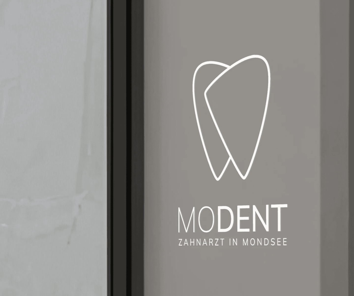 Modent Logo on Glass
