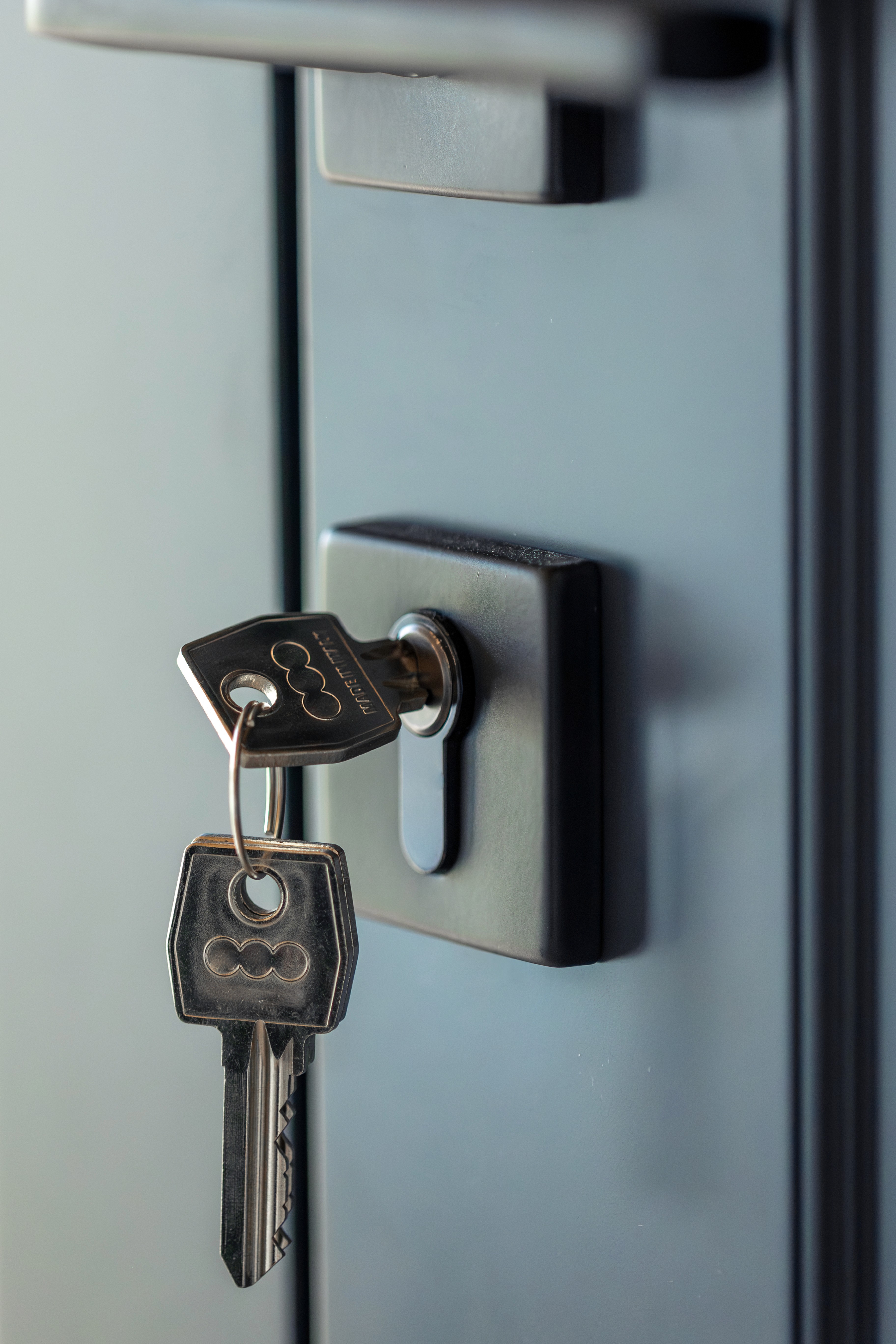 A set of keys inside a door lock