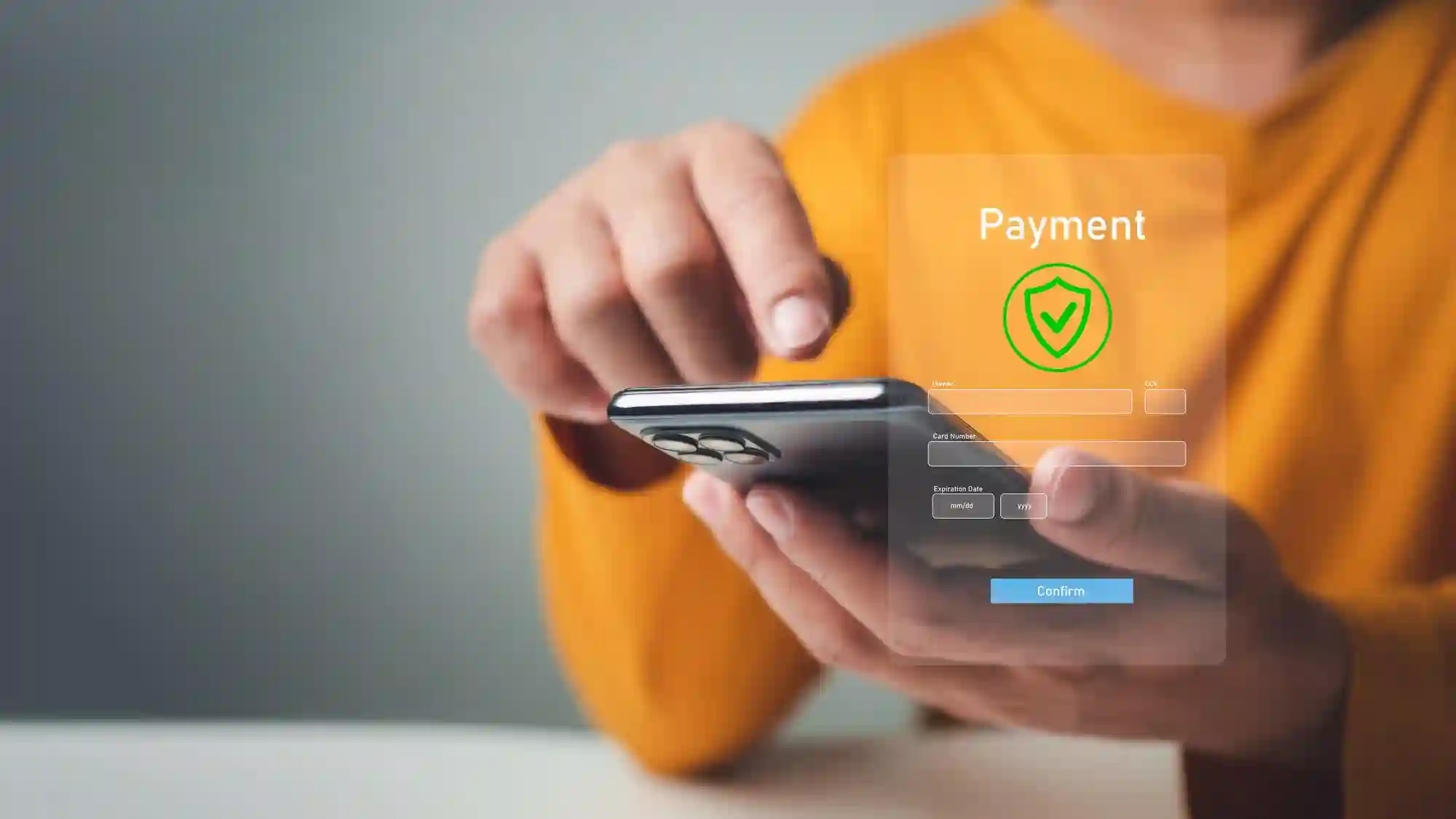 Person confirming a secure mobile payment transaction on a smartphone.