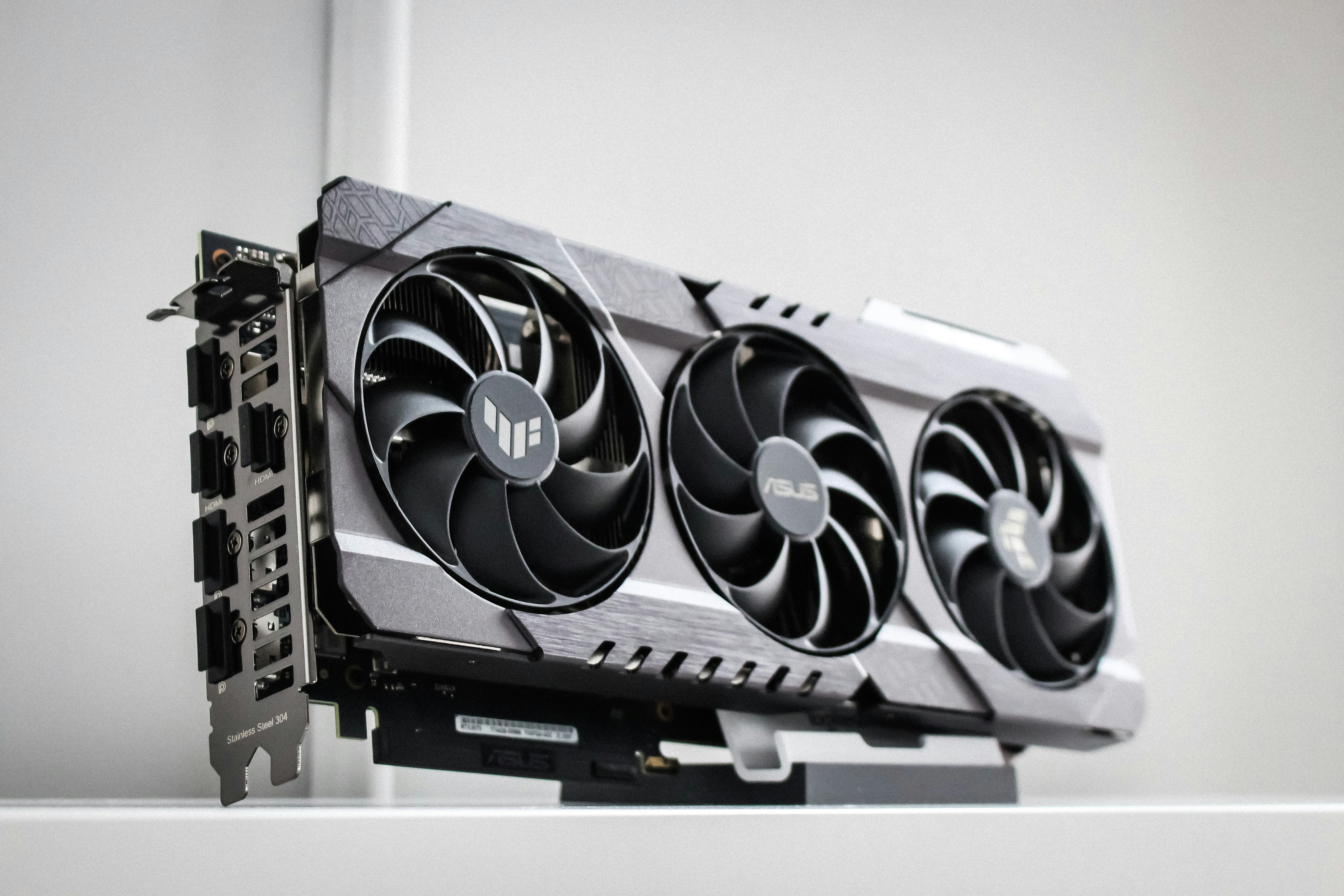 Triple-fan graphics card on a white surface