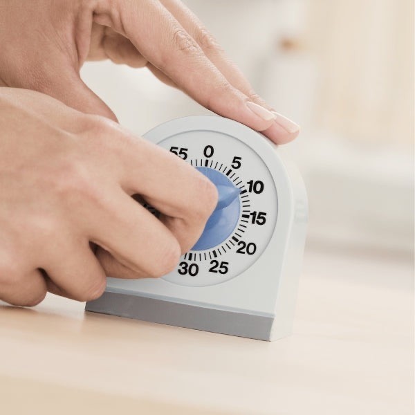 Woman Holding Stop Watch