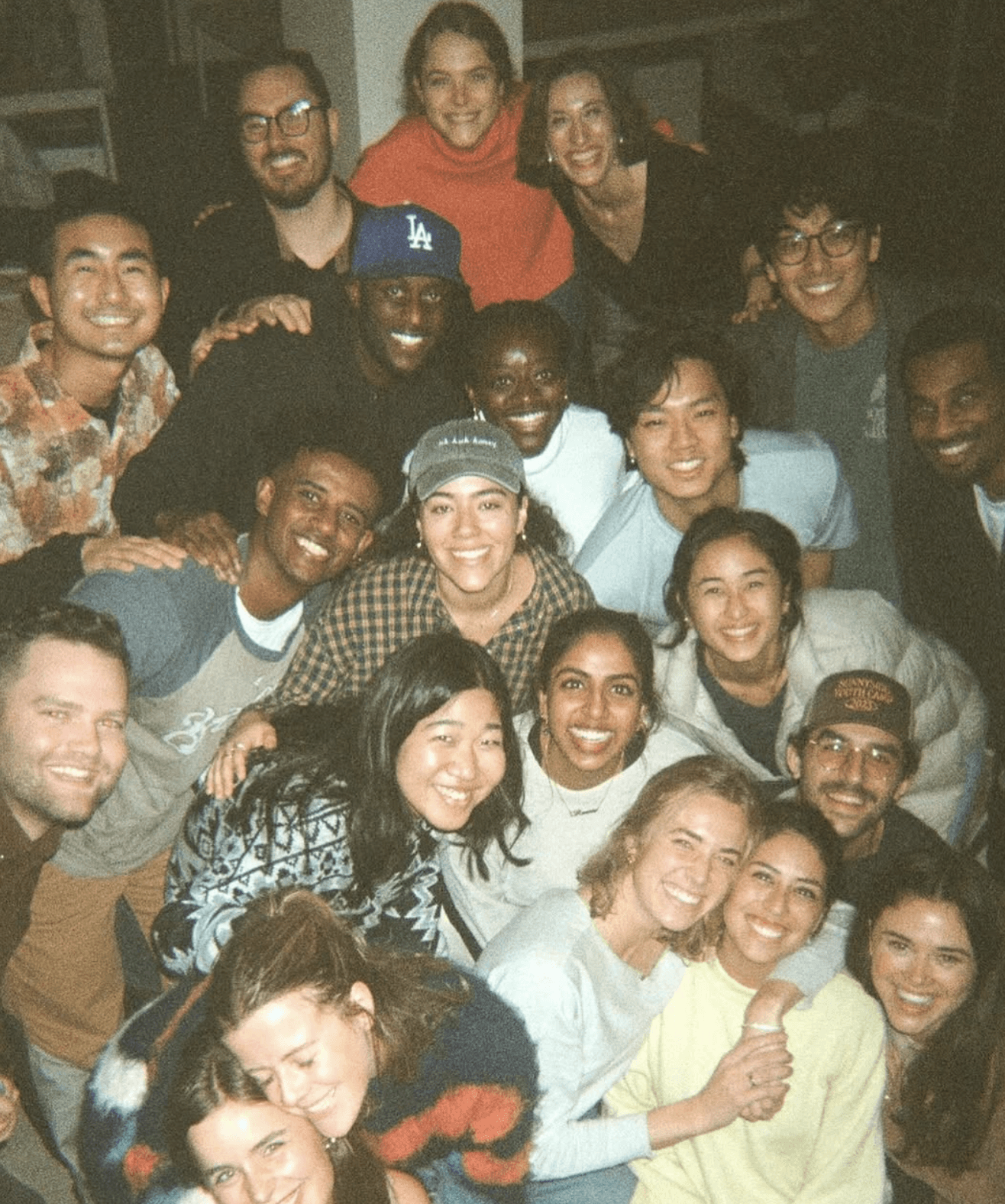 A large group smiling together in a candid YTH photograph.