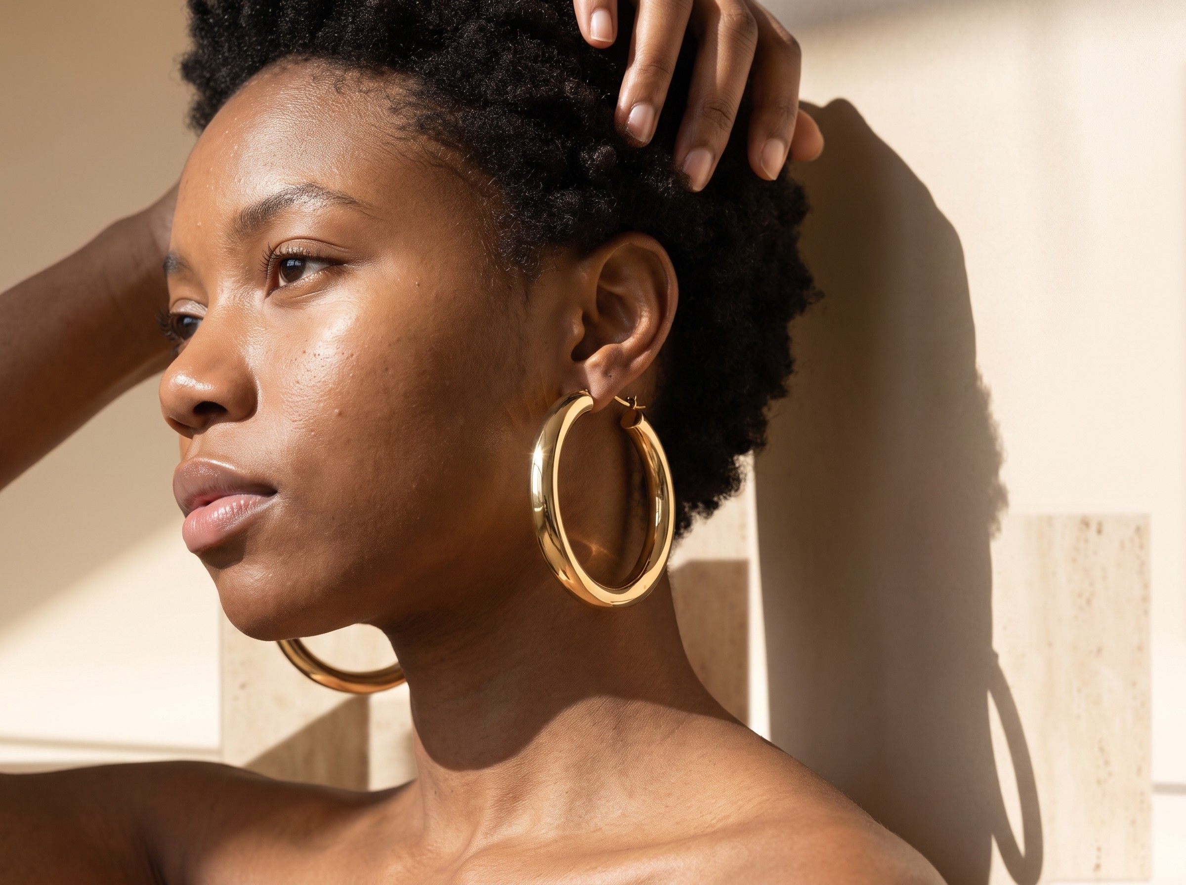AI model wearing gold hoops, hard sunlight profile