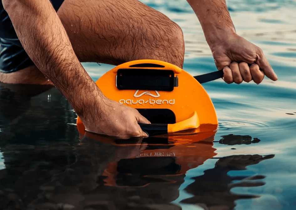 Close-up of hand fastening Aqua-Bend FLEX disc strap onto leg, Kinetic Edition for full-body training