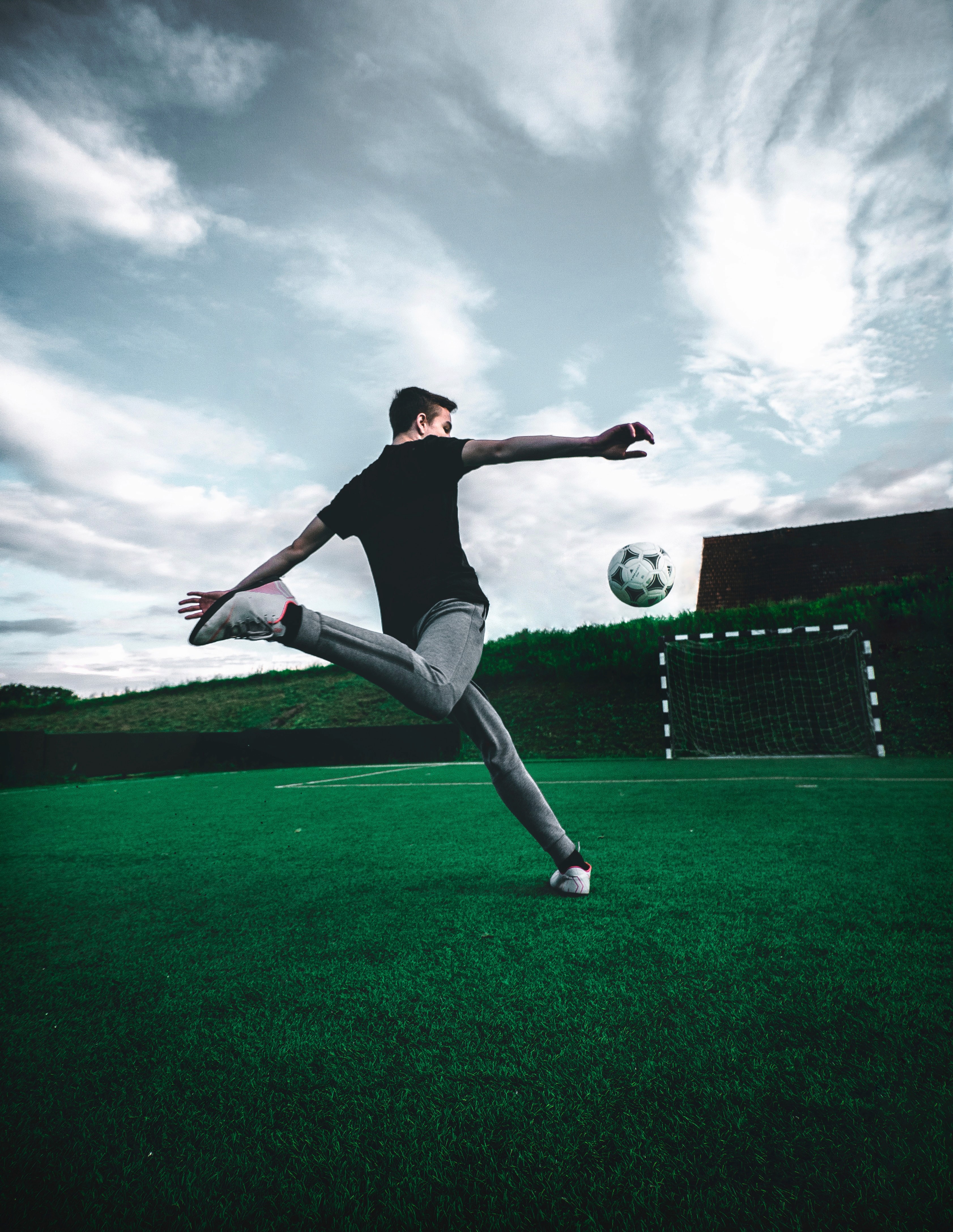 a soccer player about to make contact with the soccer ball