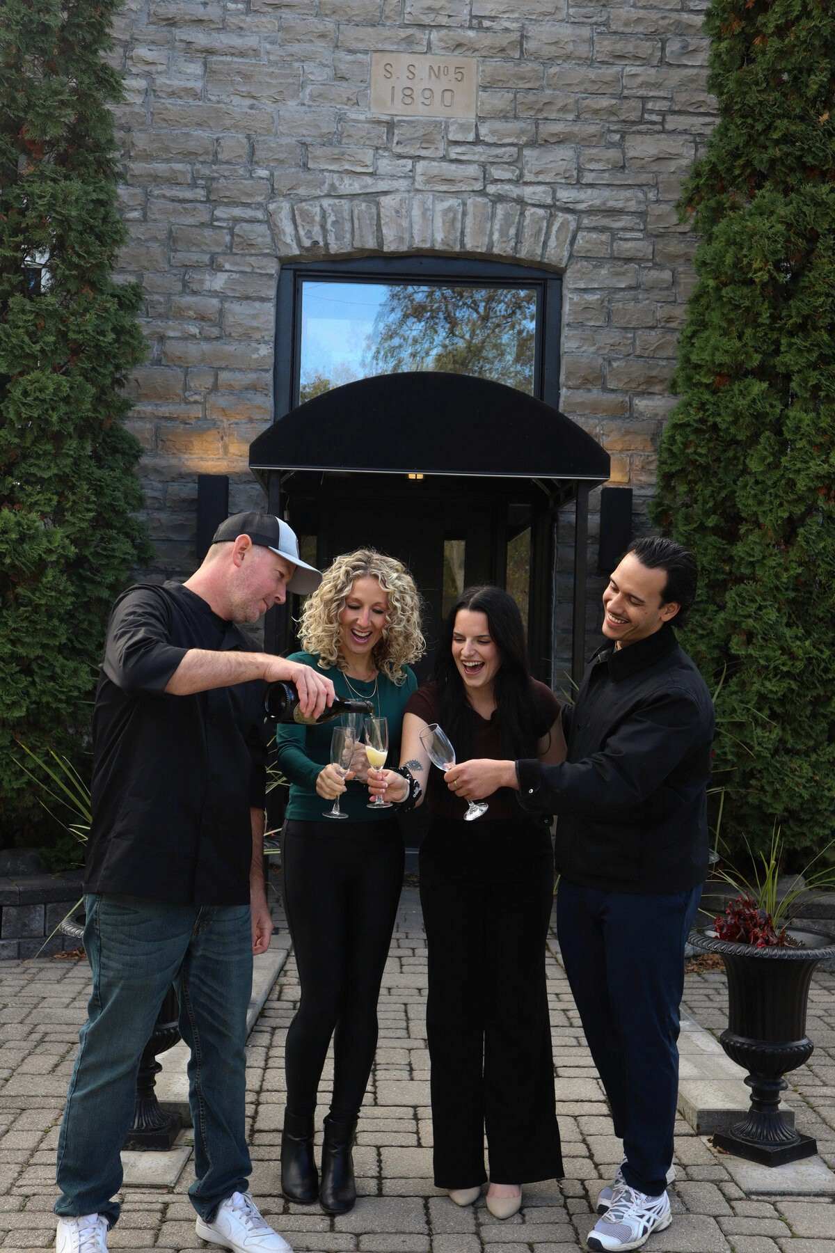 Ashlar team celebrating opening day outside of micro venue