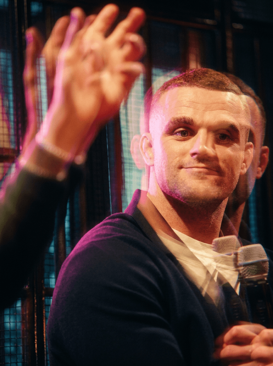 Bride and groom walking on street at night