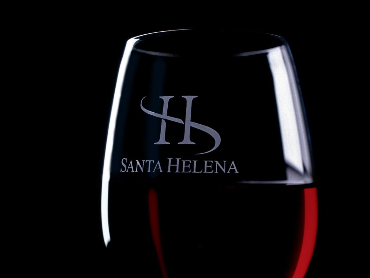 Rustic cabin in a golden field at sunset