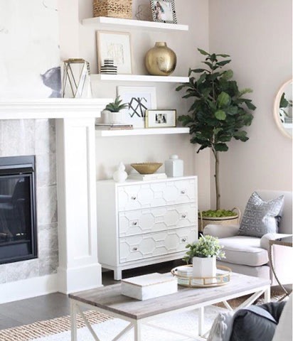 decorate on a budget by creating the illusion of a built-in cabinet