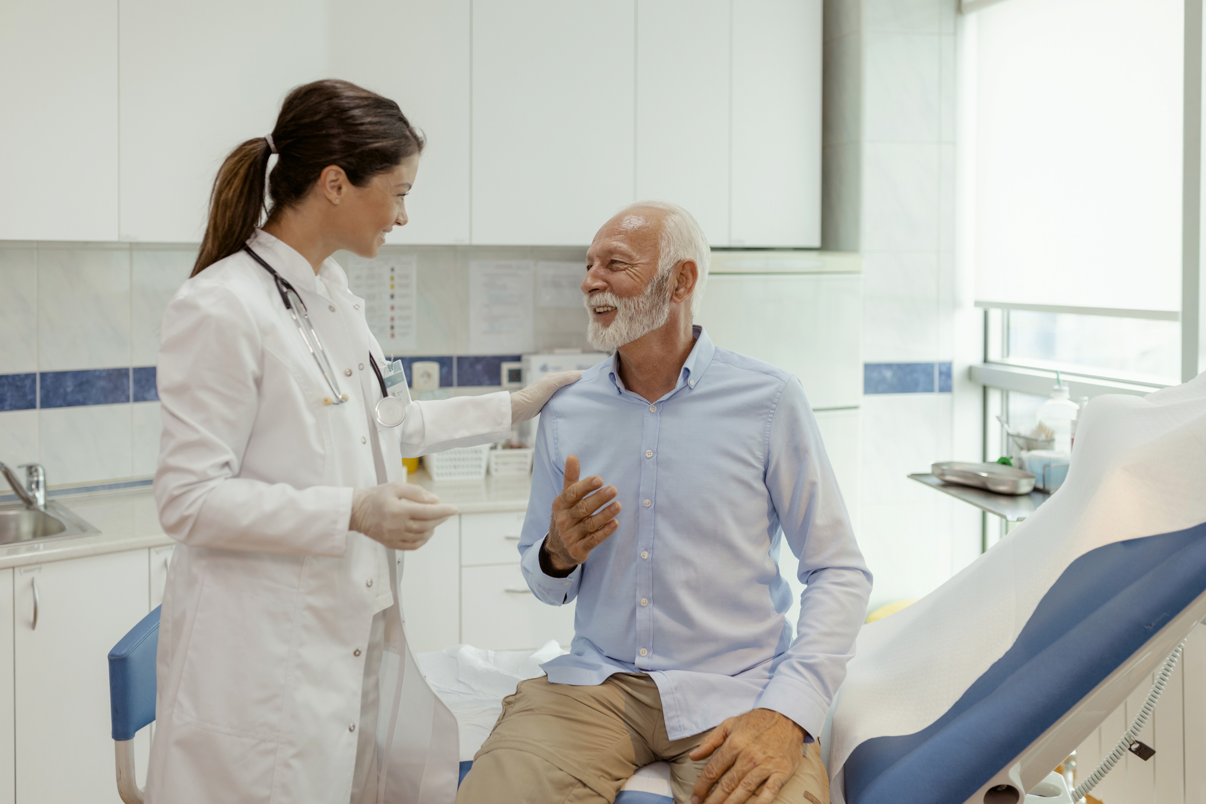 a plane flying through a cloudy blue sky