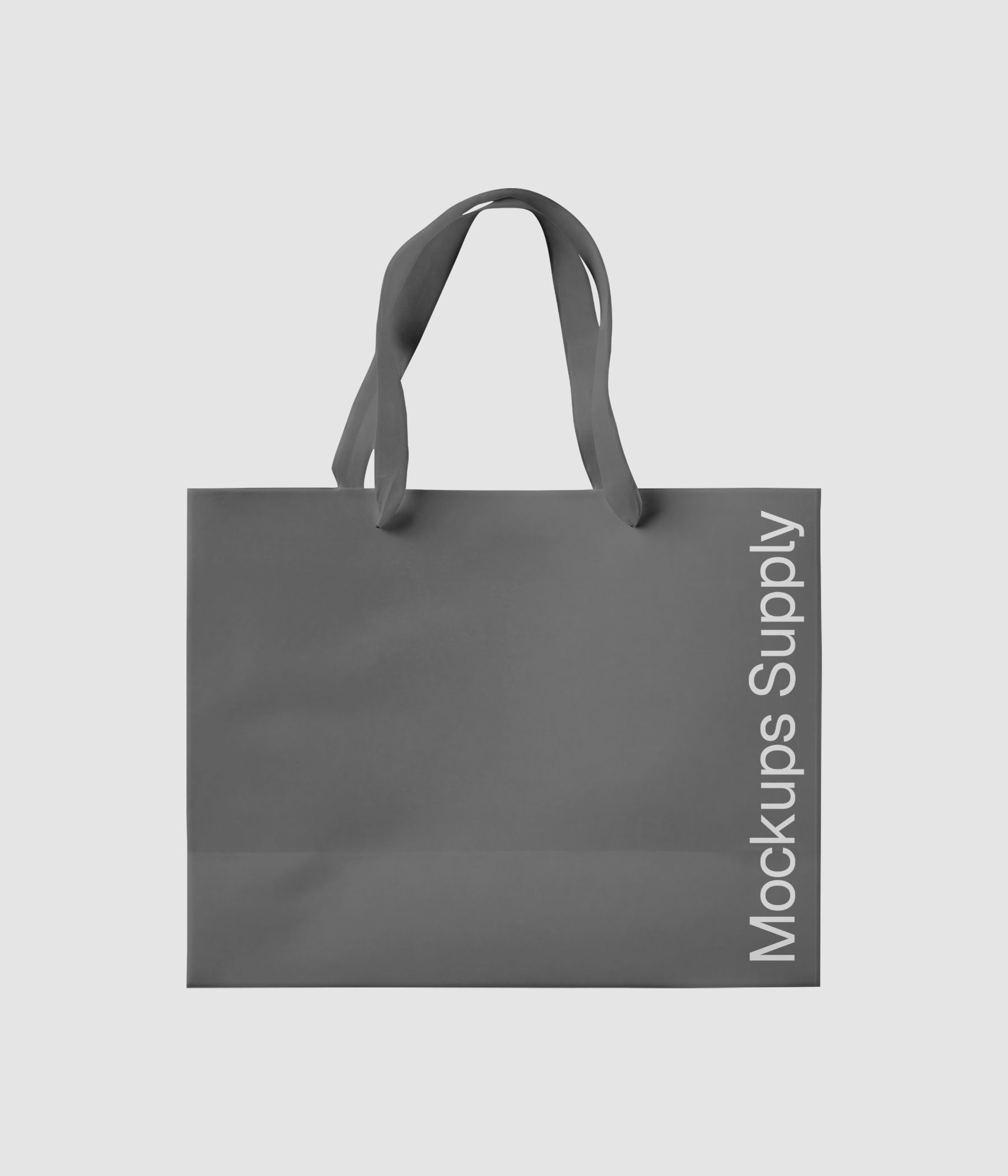 Front view of a wide paper gift bag mockup featuring a ribbon handle and clean paper finish download on Mockups Supply