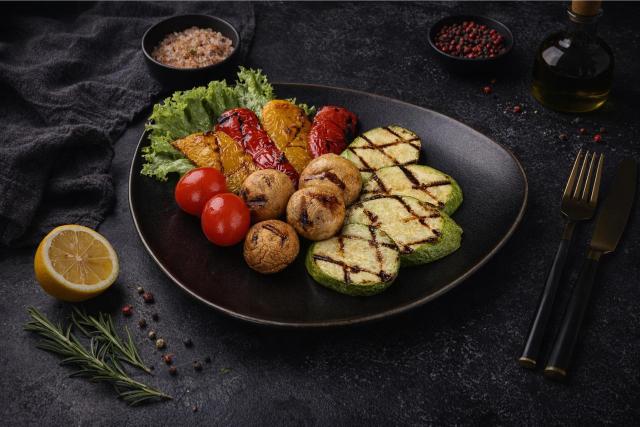 a white plate topped with meat covered in sauce