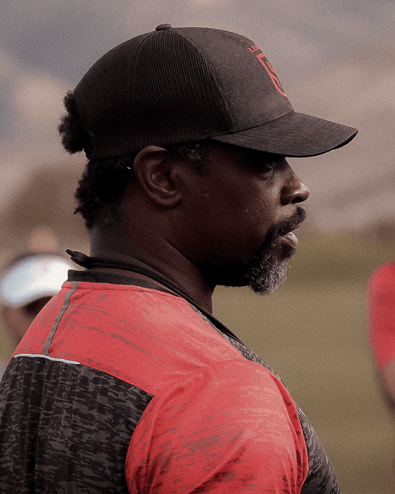 A majestic lion with a full mane stares intensely forward.