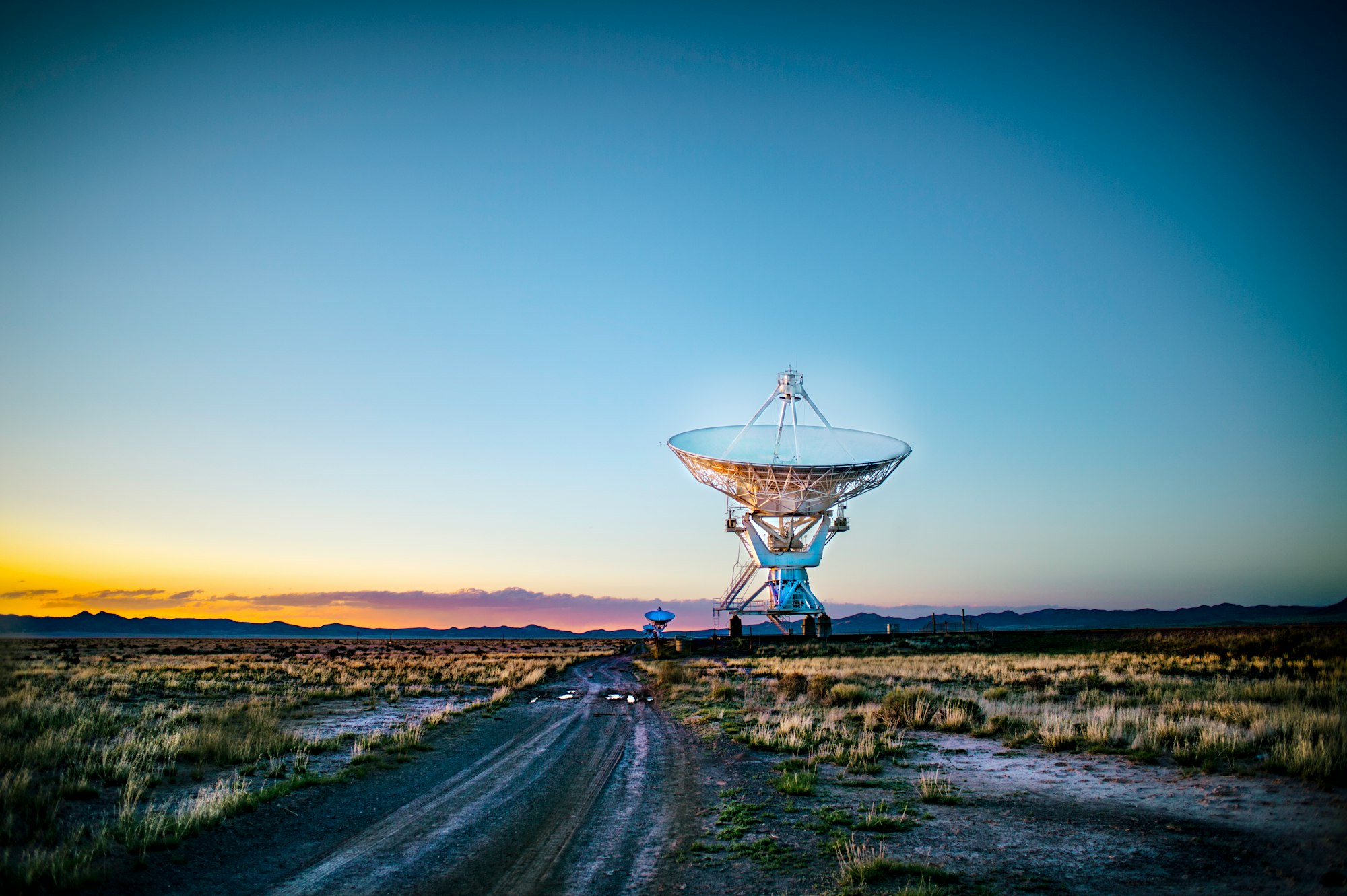 Early in the morning and quite chilly even for New Mexico high desert. I was on a motorcycle road trip and wanted to catch the early light with these fascinating telescopes in the middle of nowhere, New Mexico. A light powdering of snow made the surrounding desert quite muddy, so I had to keep my distance.