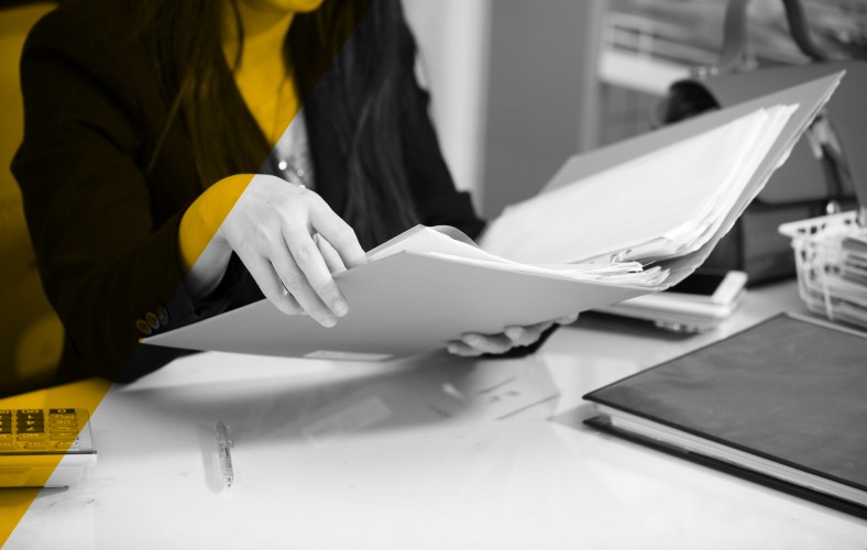 Financial professional reviewing documents, representing AI-powered underwriting and risk analysis