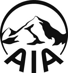 Black silhouette of mountains with a person climbing, framed by a circular design.