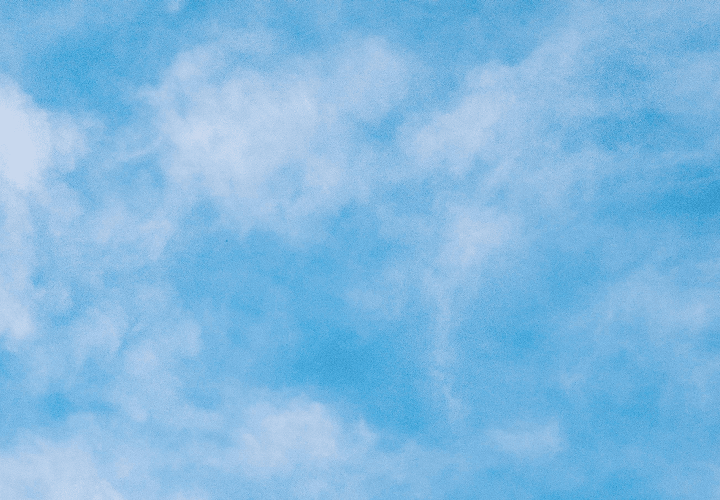 kids lying on a glass land and smiling