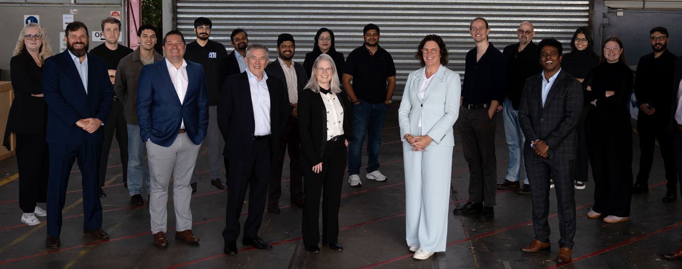 The ARM Hub team standing together on the workshop floor