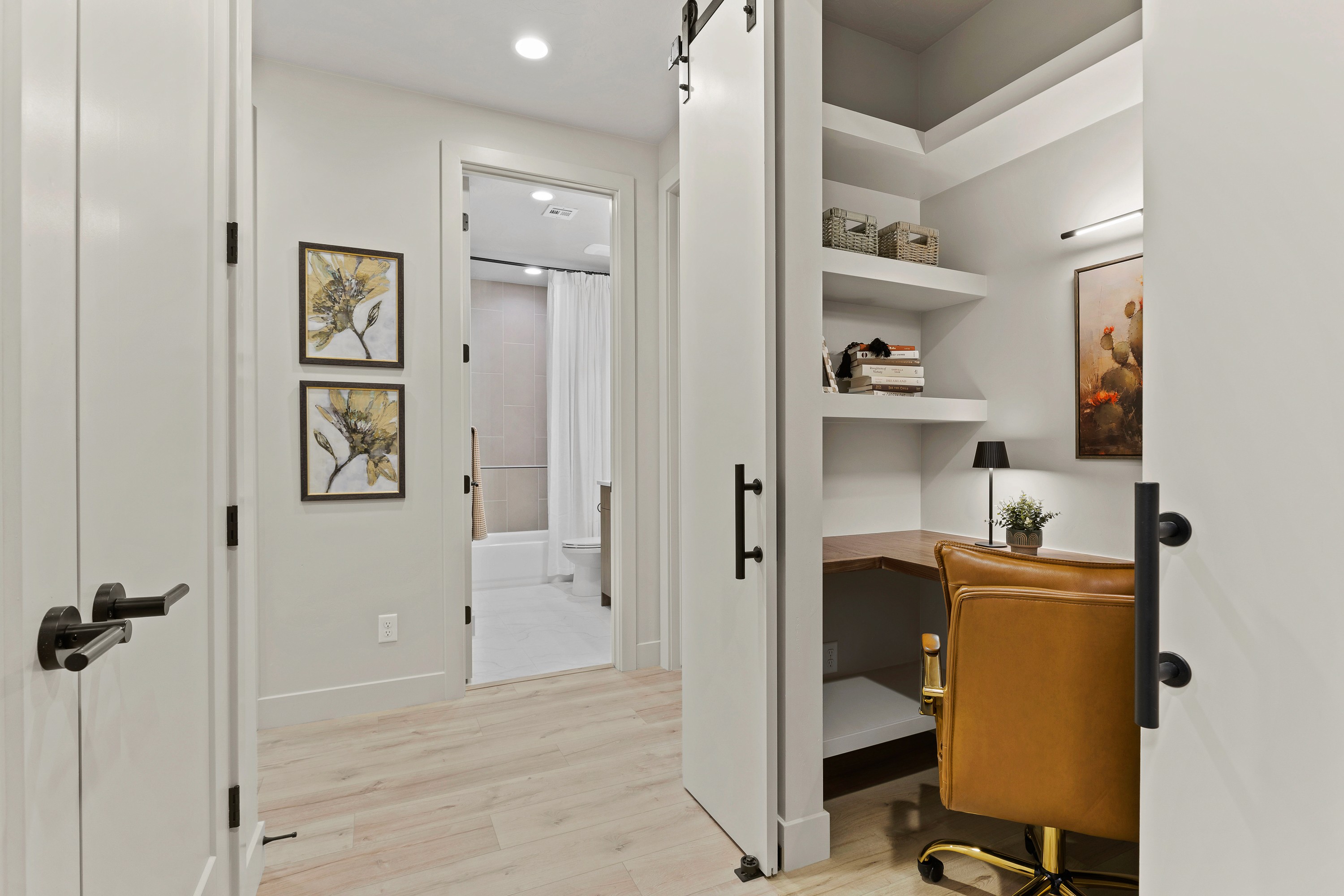 Hall desk workspace inside The Painted Horizon twin home in Hurricane, Utah featuring a built-in desk for work or study.