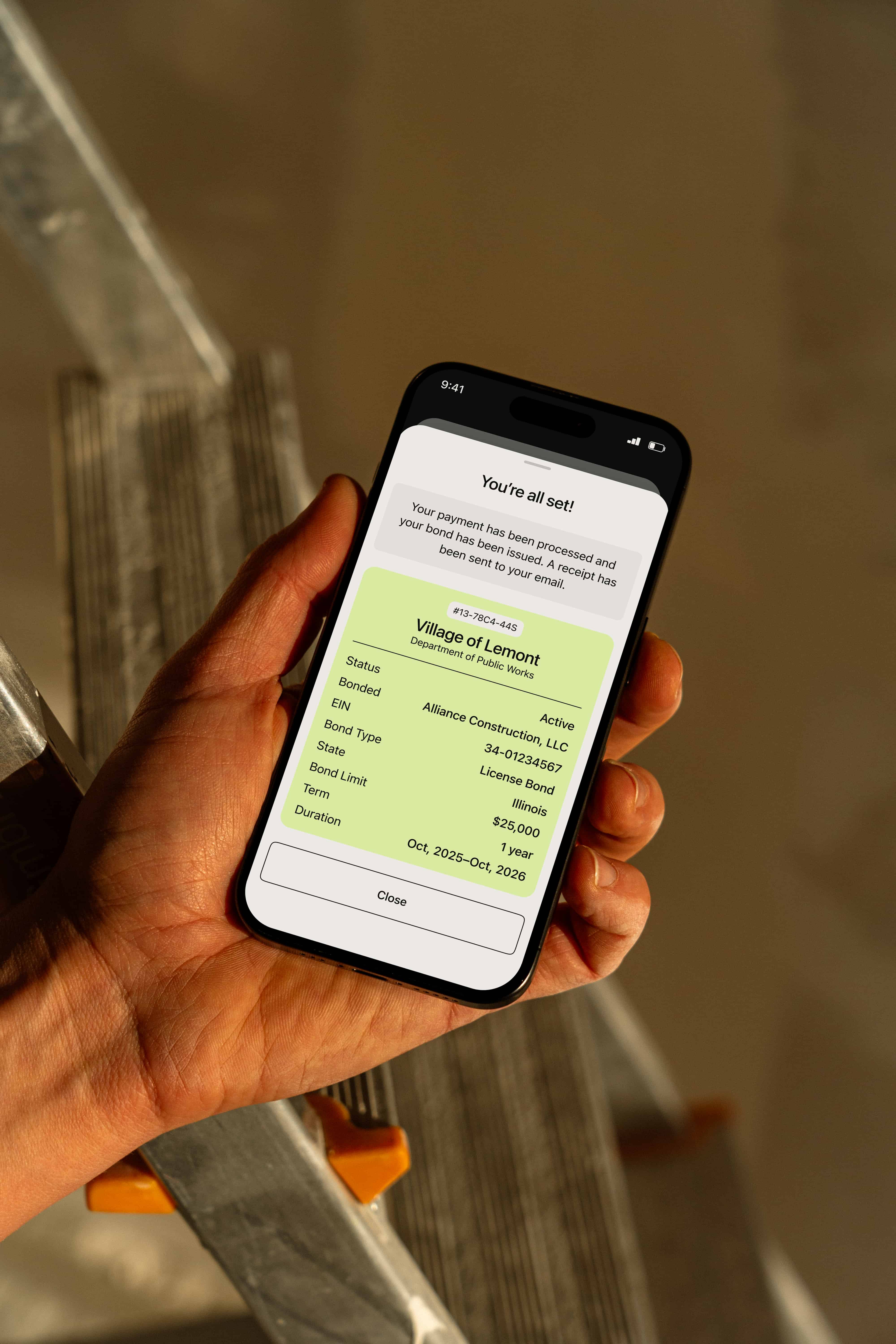Smartphone showing Bondlord confirmation screen indicating a bond has been issued for the Village of Lemont, with details like bond type, limit, term, and active status.