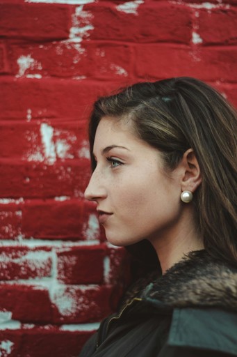 person in front of a red wall