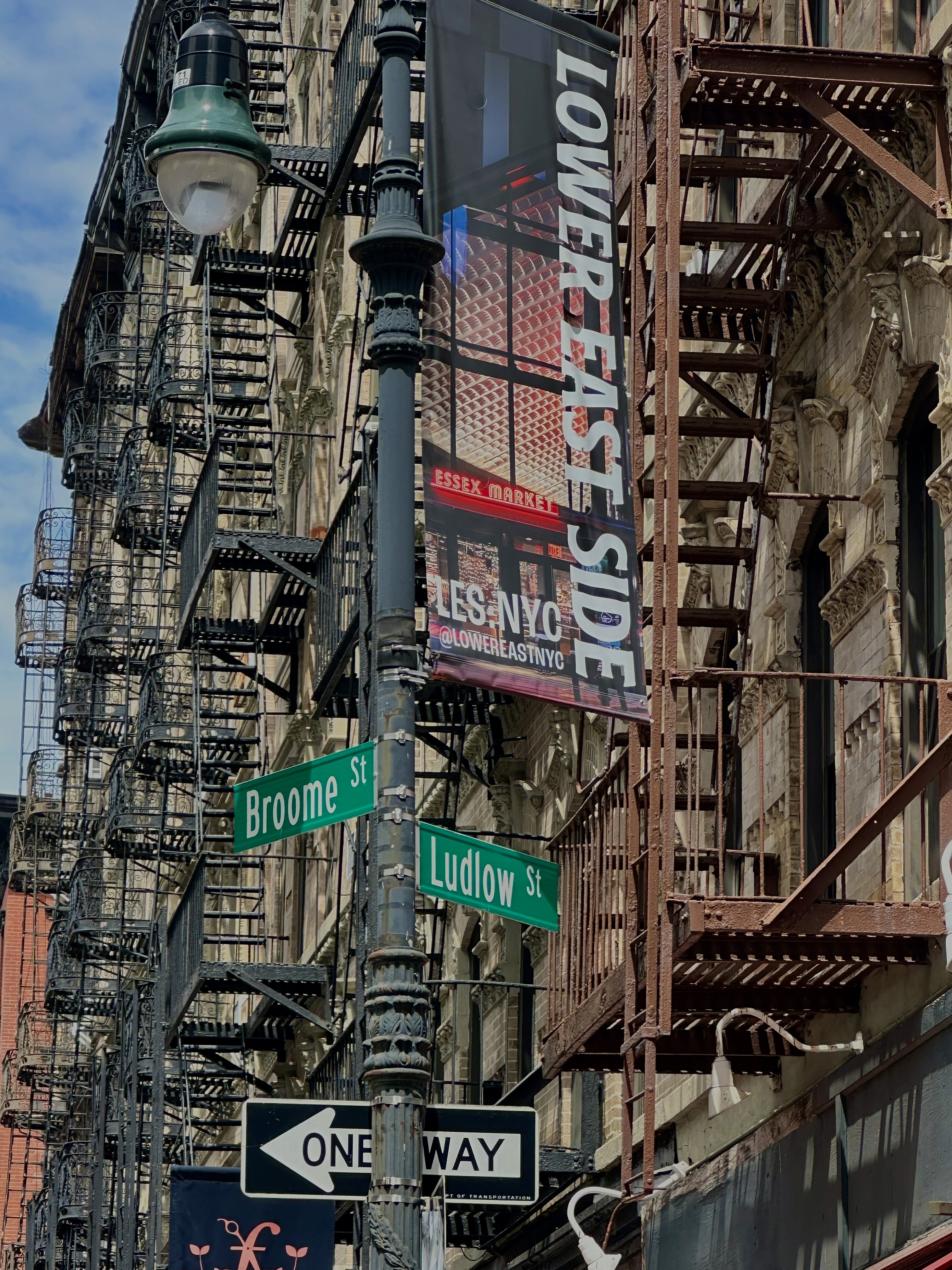 Que Linda NYC salon location — corner of Broome St and Ludlow St in Lower East Side Manhattan. Latina-owned NYC hair salon offering custom hair color, precision cuts, seamless extensions, and textured hair services.