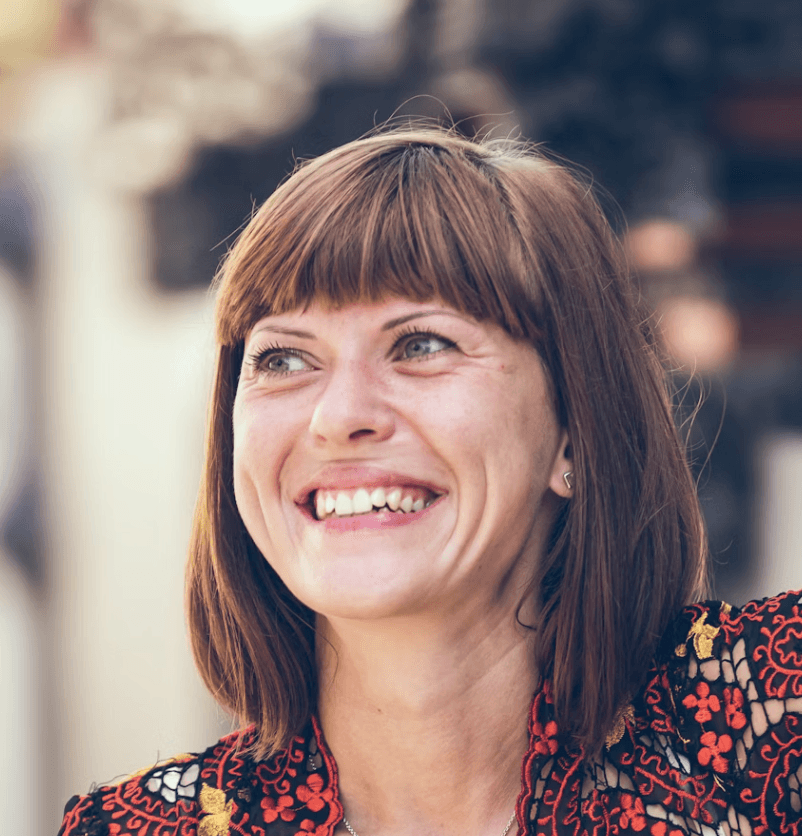 man in gray polo shirt smiling