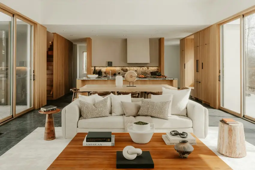 Modern living room and kitchen with natural wood accents.