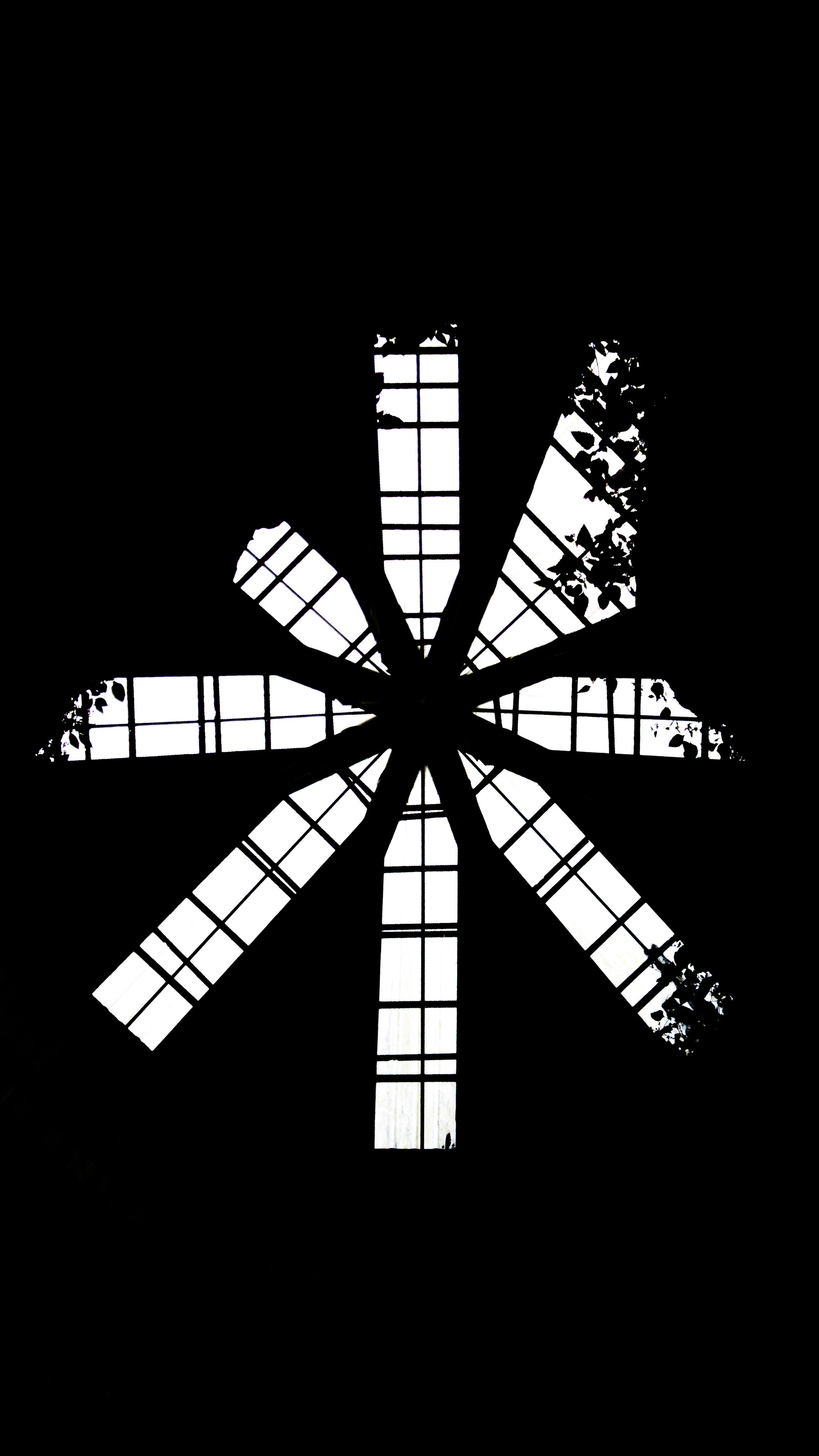 A black and white photo of a cross