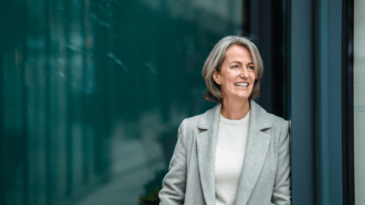 kate standing infront of a black wall