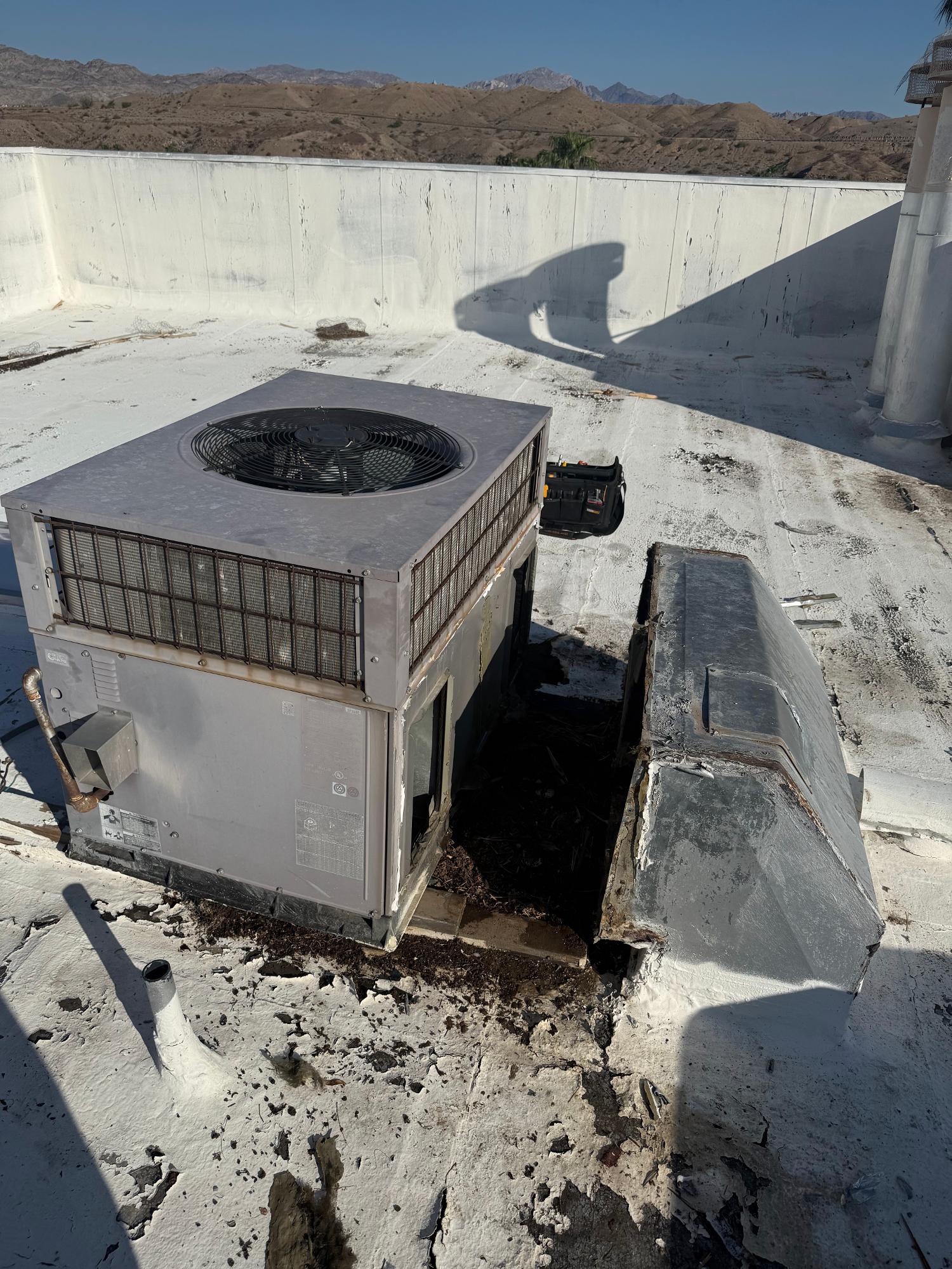 A damaged and old ac unit before a replacement service