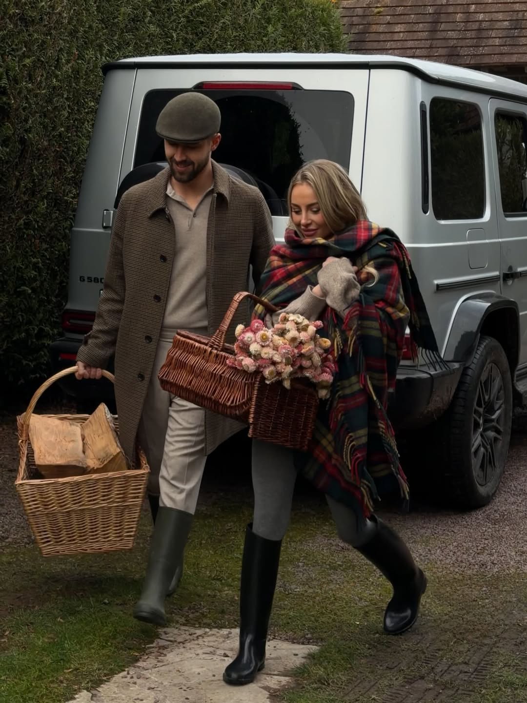 a couple in front of a car 