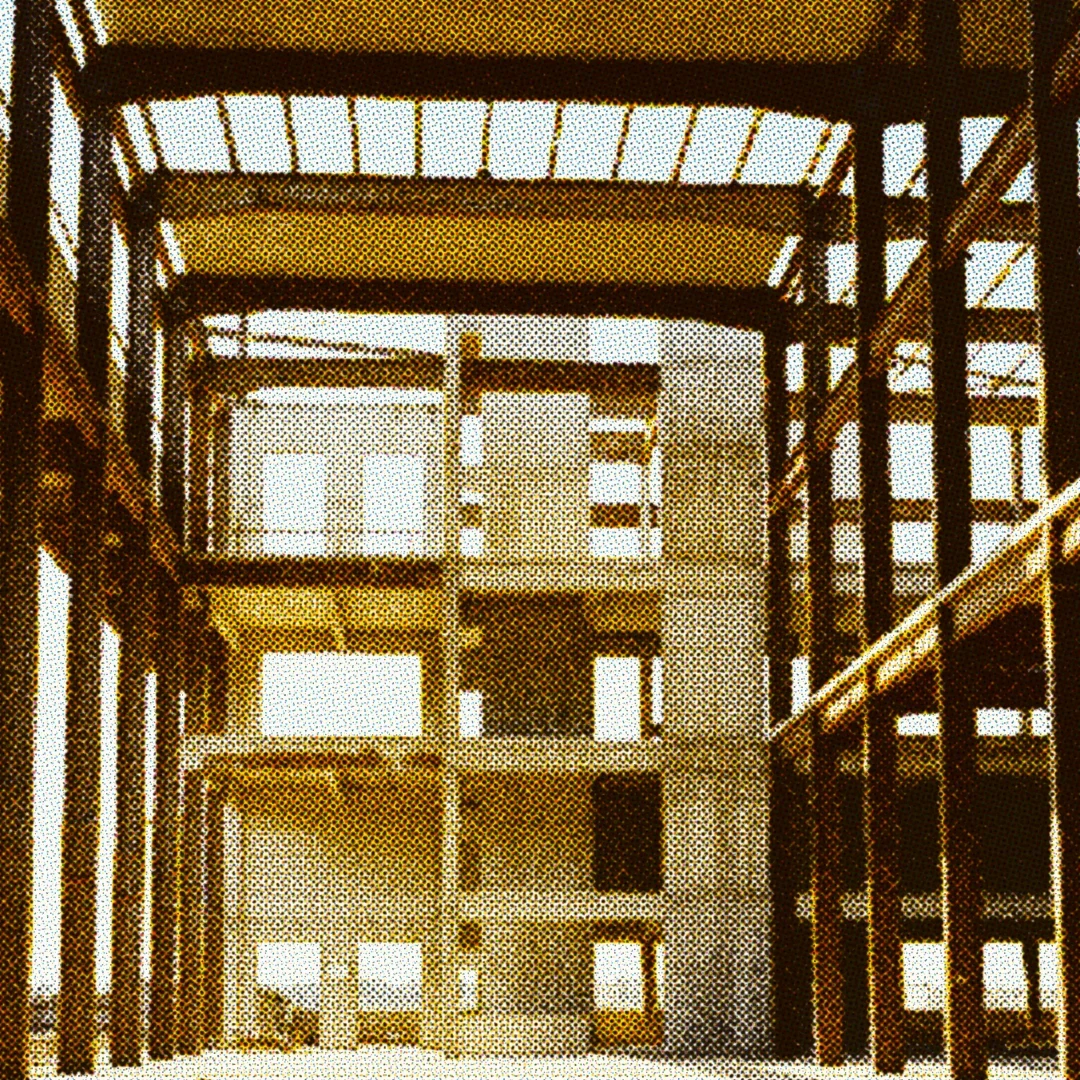 Close-up of hands working with equipment, representing the challenges and realities of building and managing your own manufacturing operations.