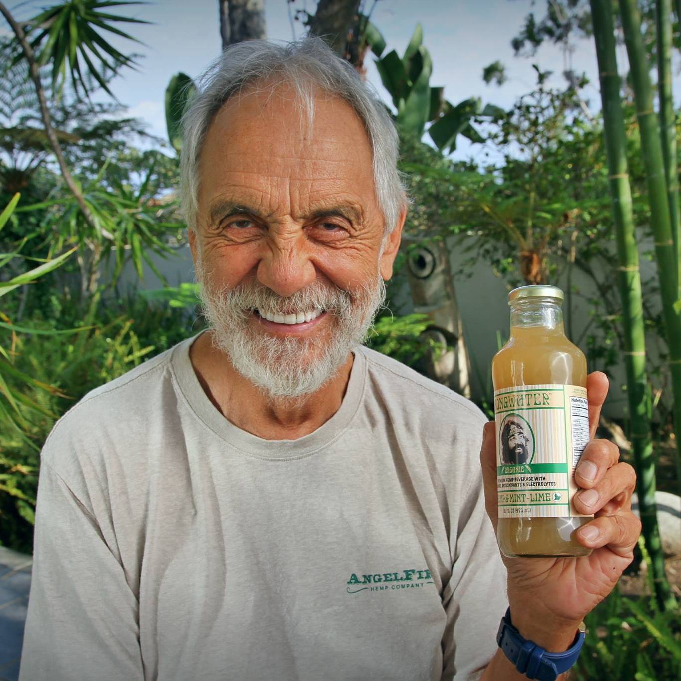 Stack of modern books and magazine with minimalist cover design on leather chair