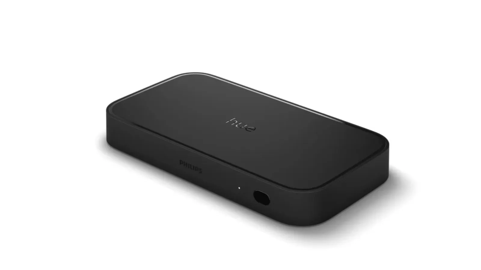 A sleek black rectangular device, likely a smart TV accessory, with the brand logo in the centre and connection ports along the side.