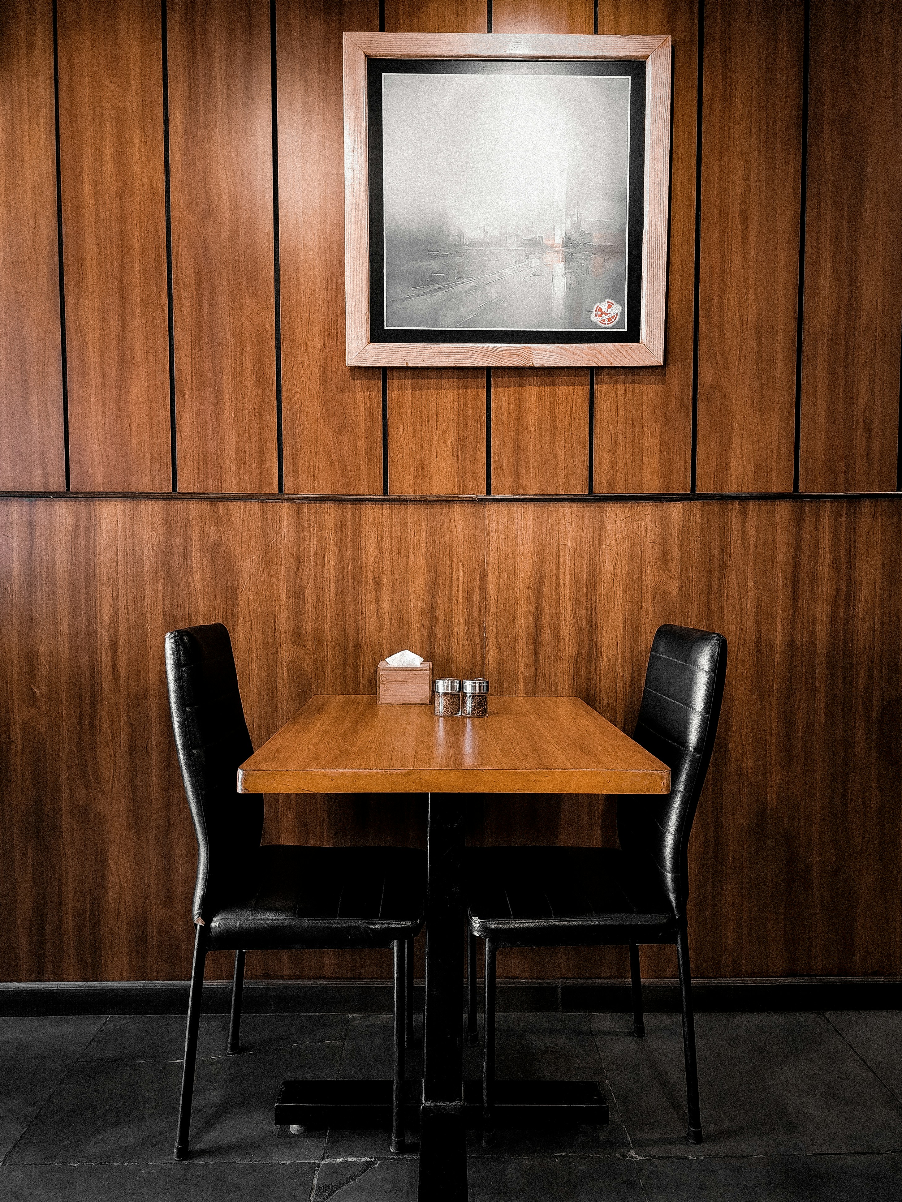 a table and chairs in front of a television