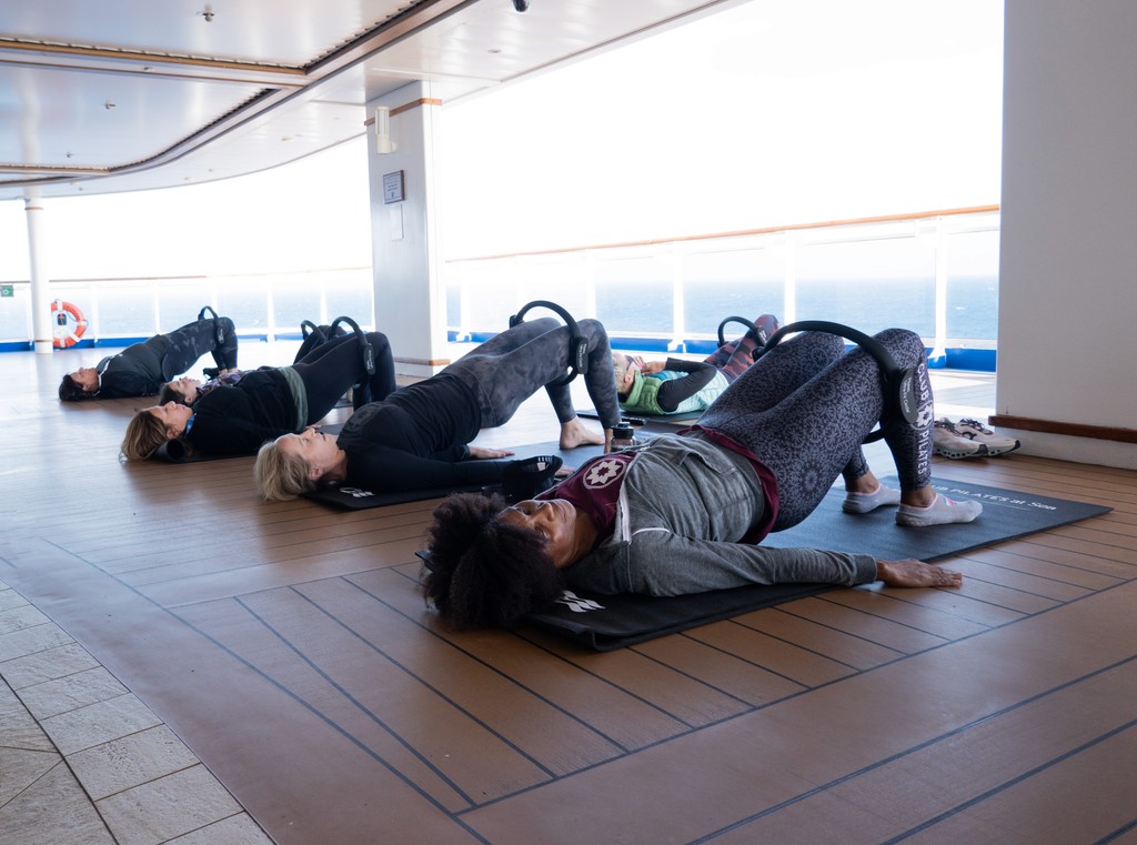 A group of Club Pilates members posing together