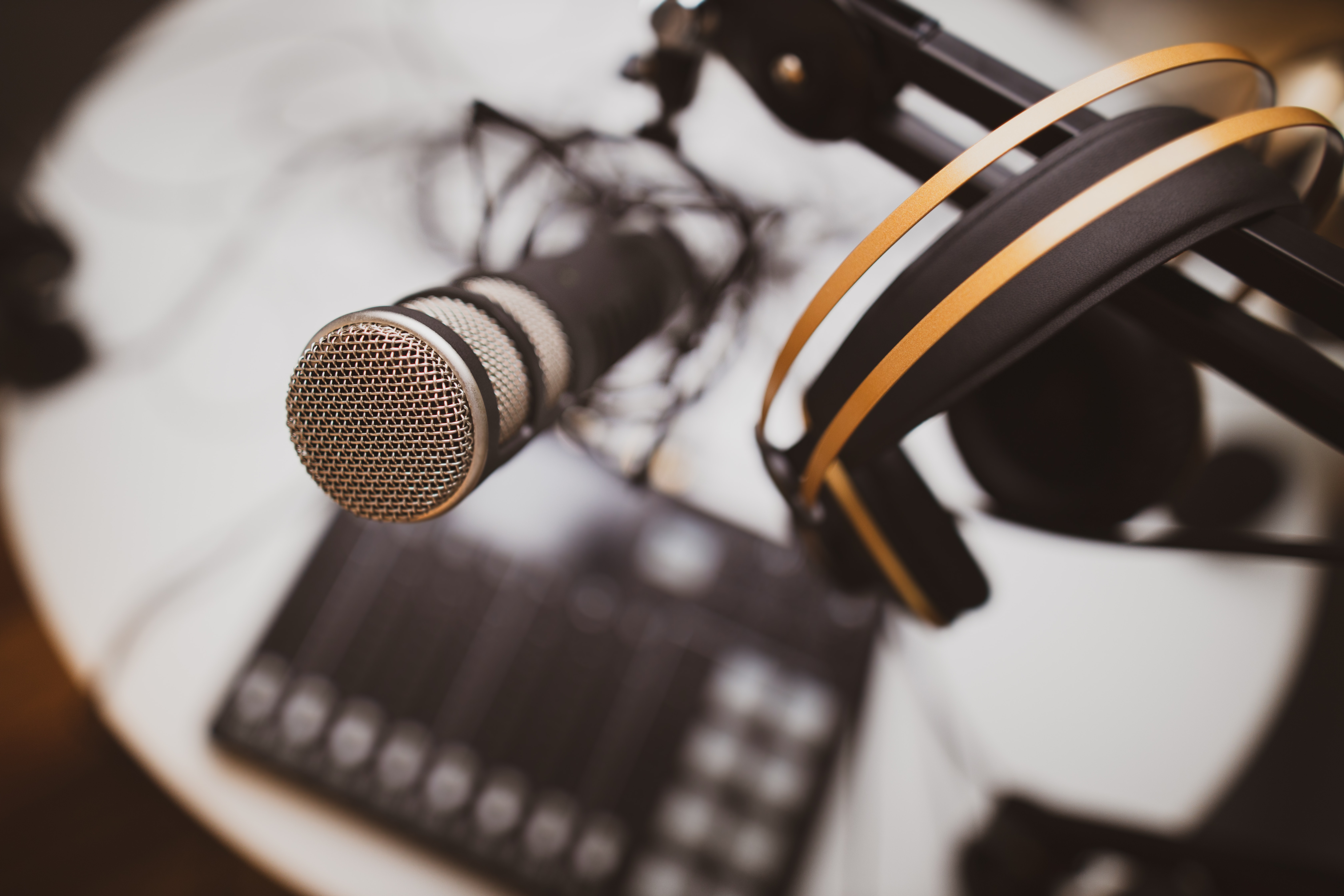 a closeup shot of a microphone from a singer's POV - Kits AI vs Musicfy 