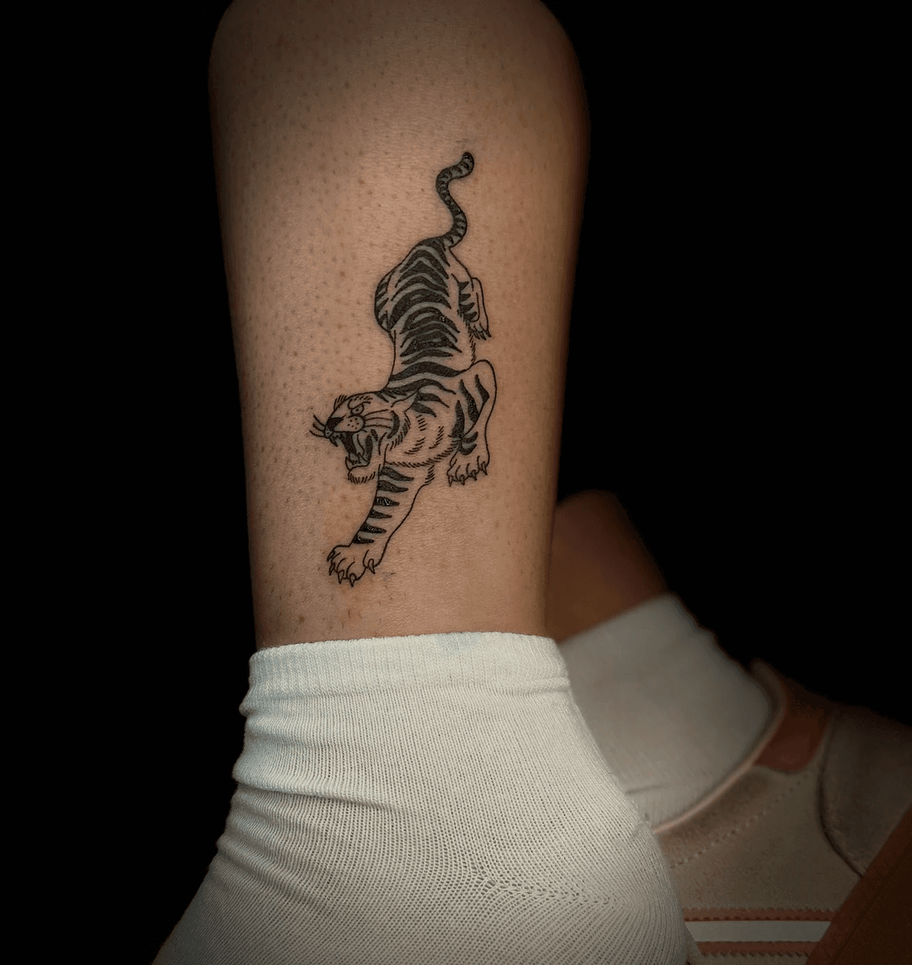 Comprehensive sleeve tattoo collection, including lighthouse, ship, broken chains, dolphins, anchor, floral designs, and various meaningful symbols inked in minimalist and traditional styles. Artwork by Jai, Bloodworks Tattoo Studio, Auckland.