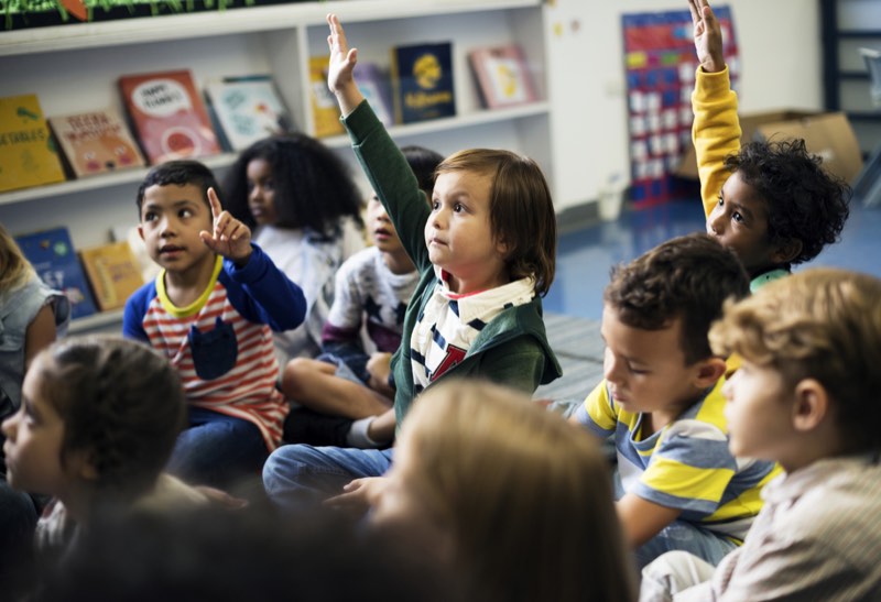 children learning attentively at school