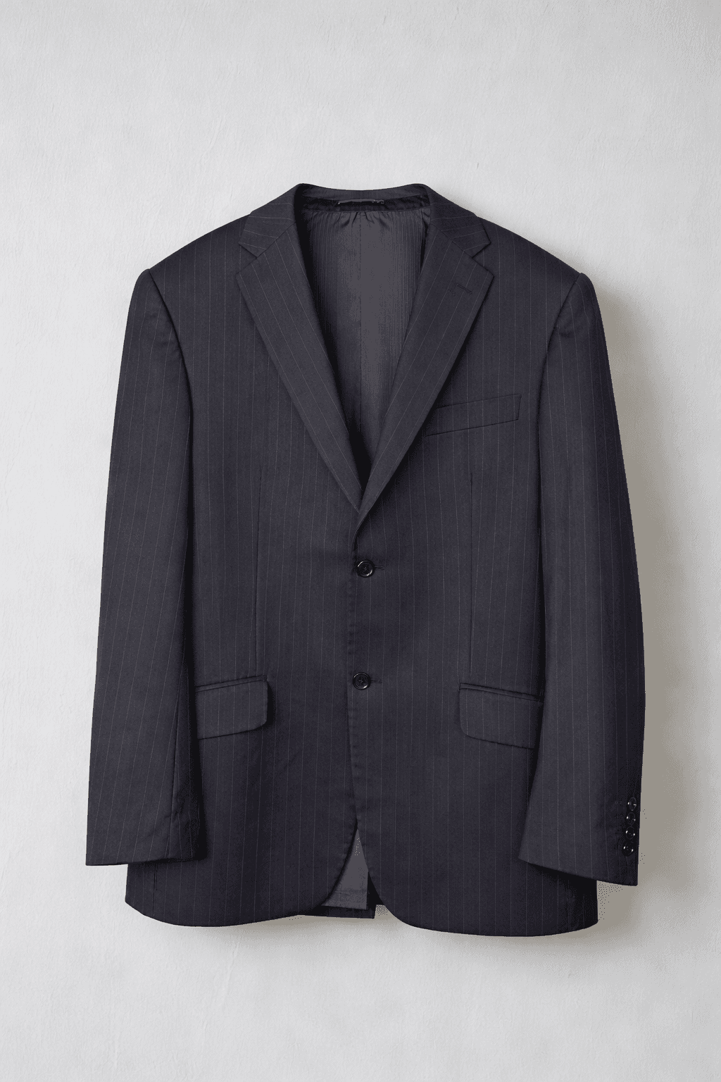 Men's pinstriped suit jacket on a plain background