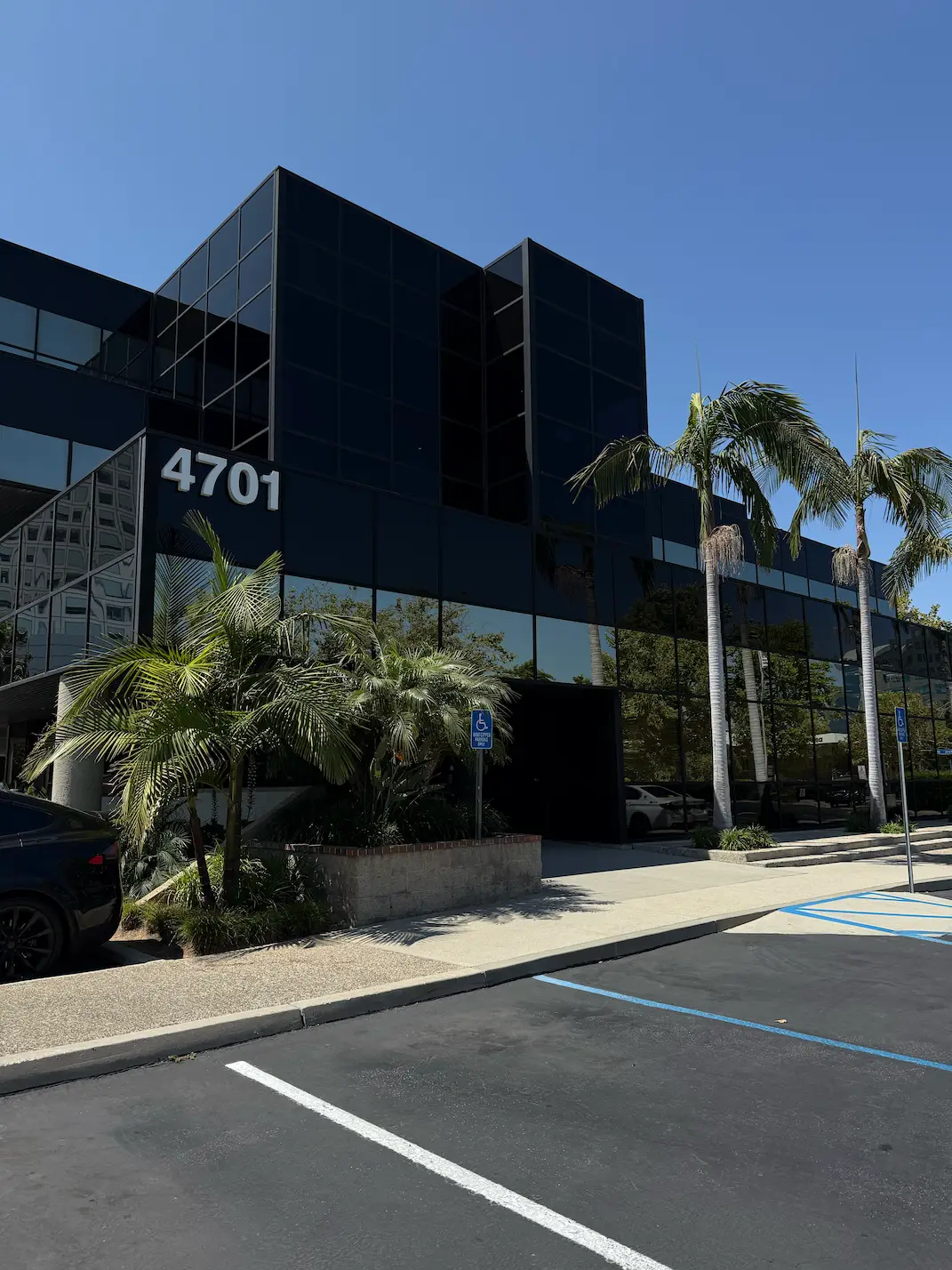 Light lobby space with beauty-themed art prints on walls