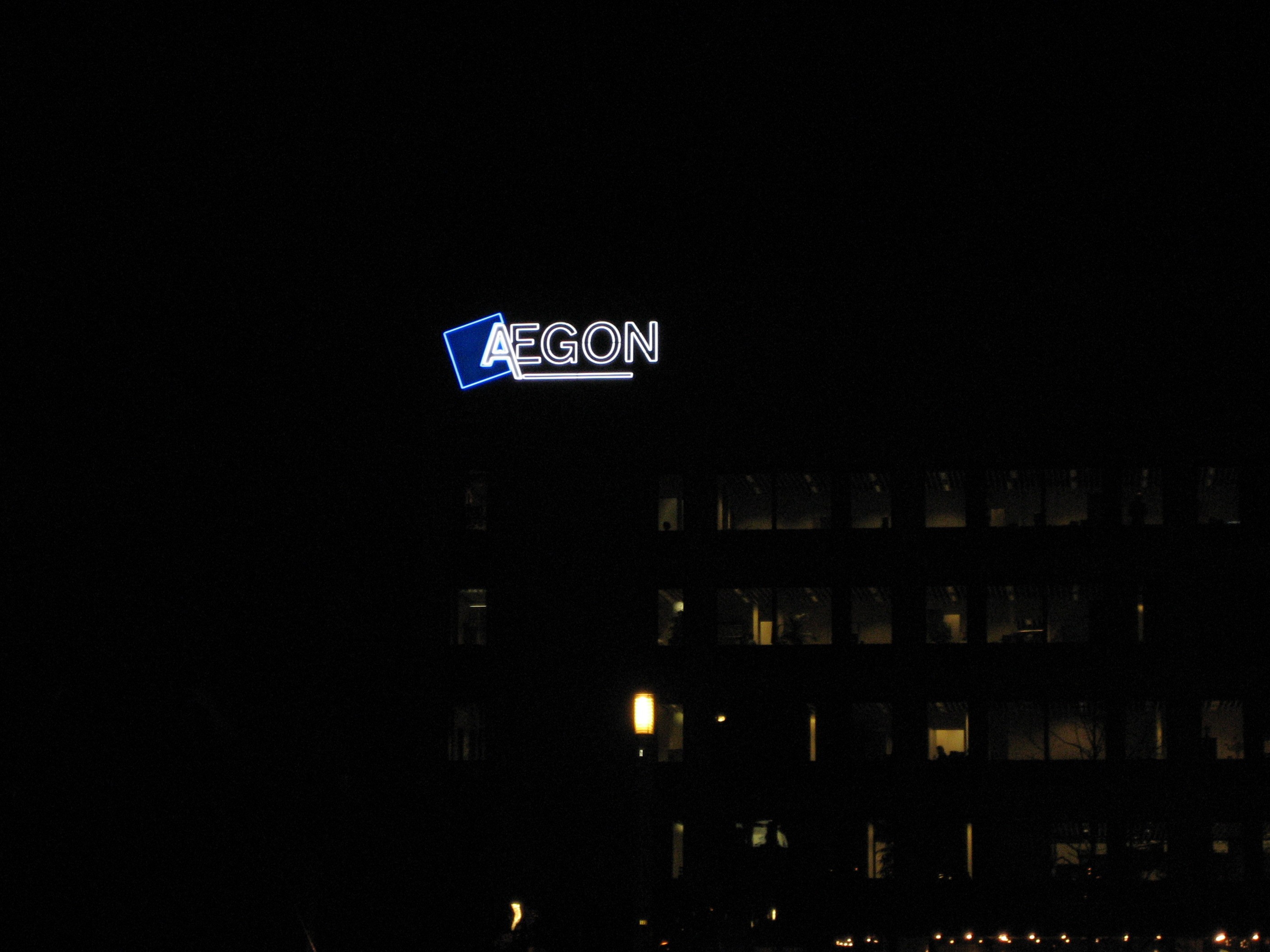 night view of an illuminated Aegon sign