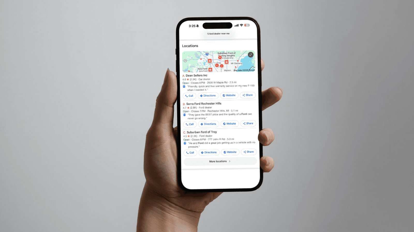 Phone showing a business's multiple locations in local search results