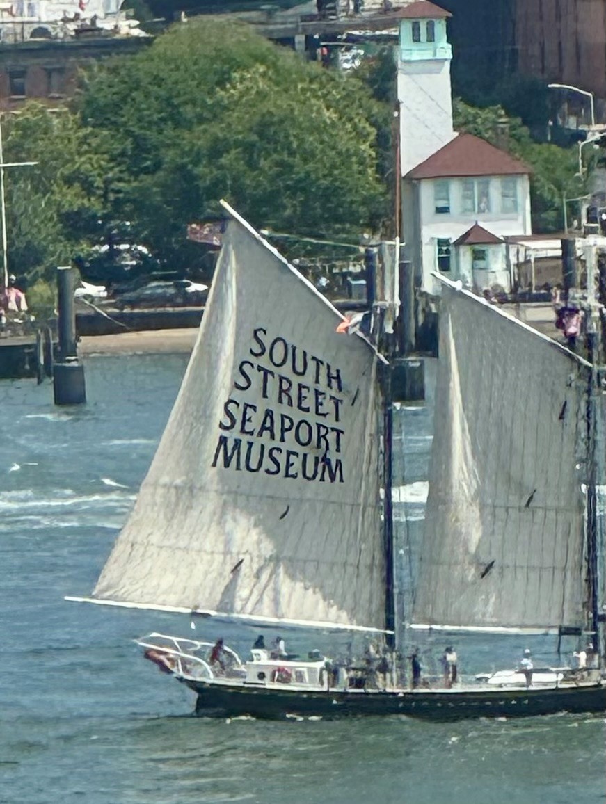 A ship whose sail reads "South Street Seaport Museum"