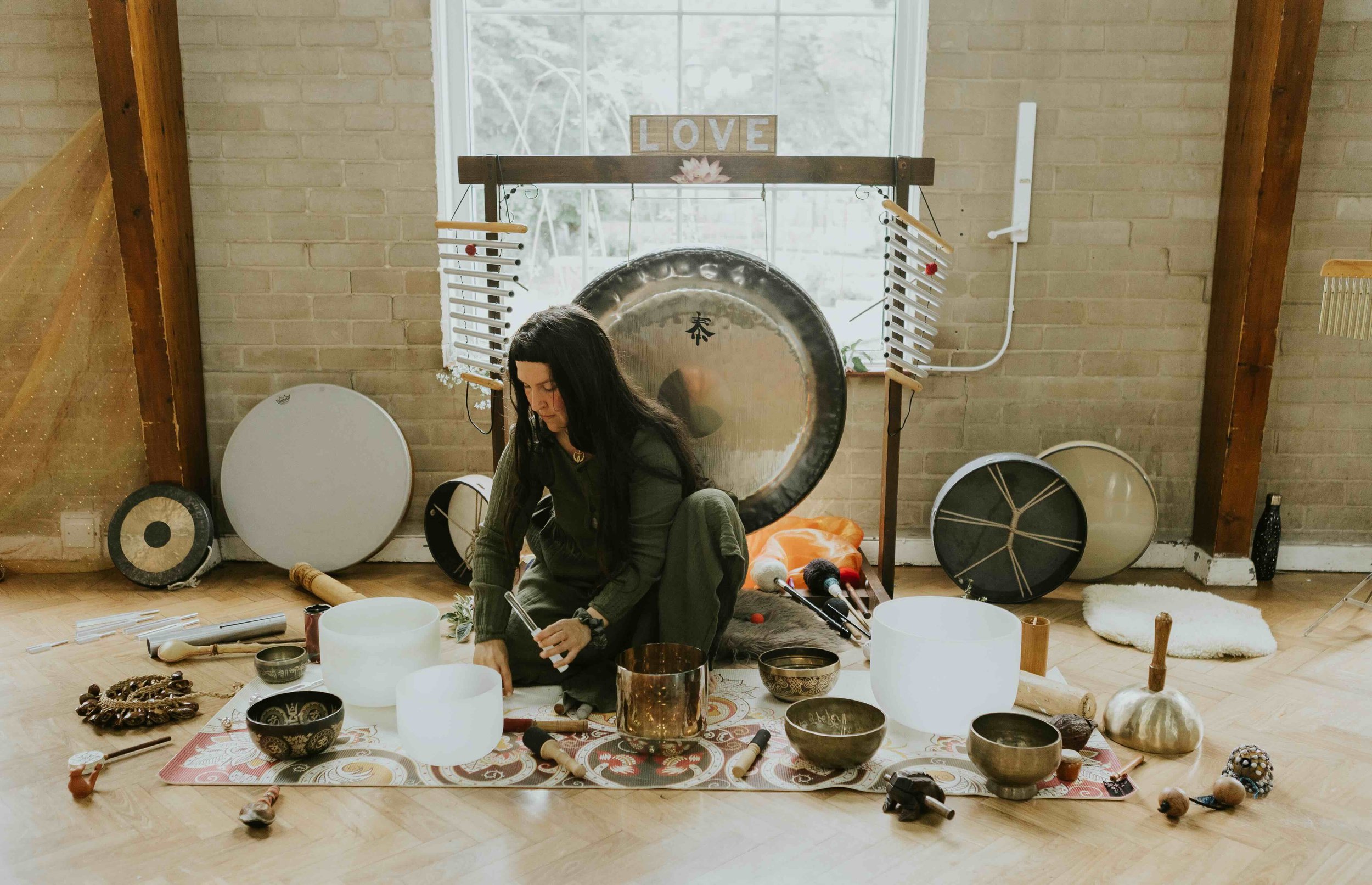 Sofia playing the crystal bowls