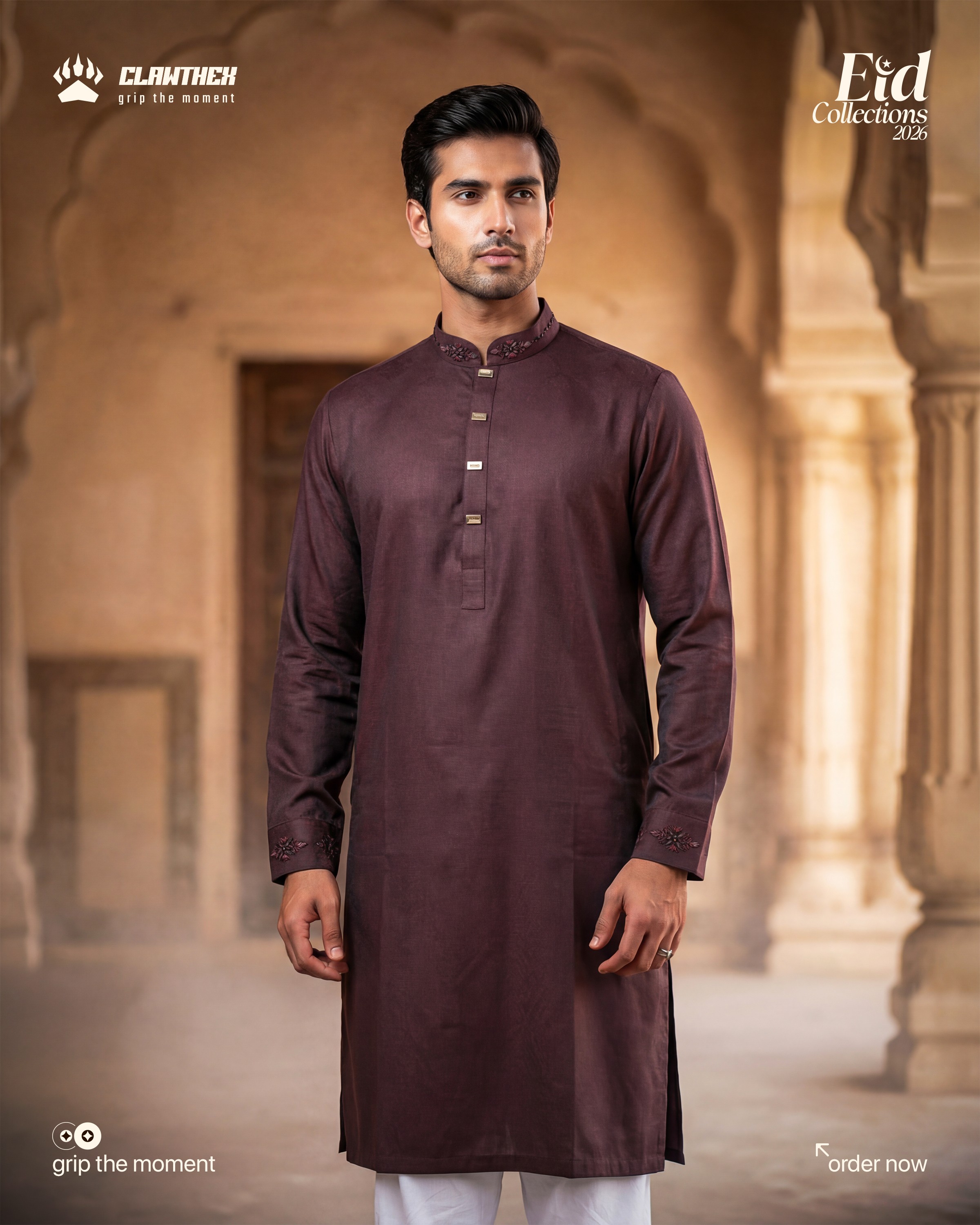 a man with a beard and glasses standing in front of a lamp