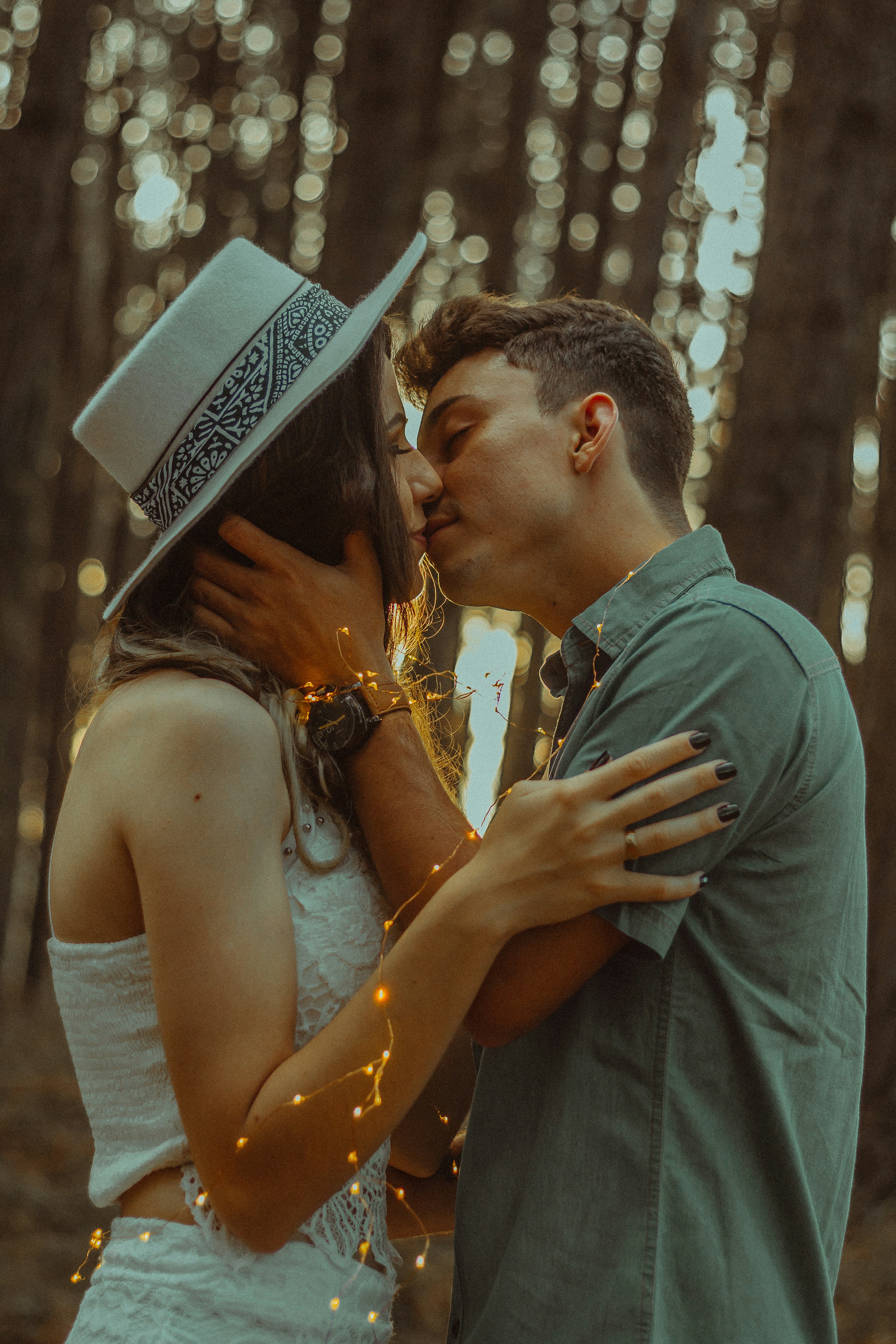 couple kissing in the forest