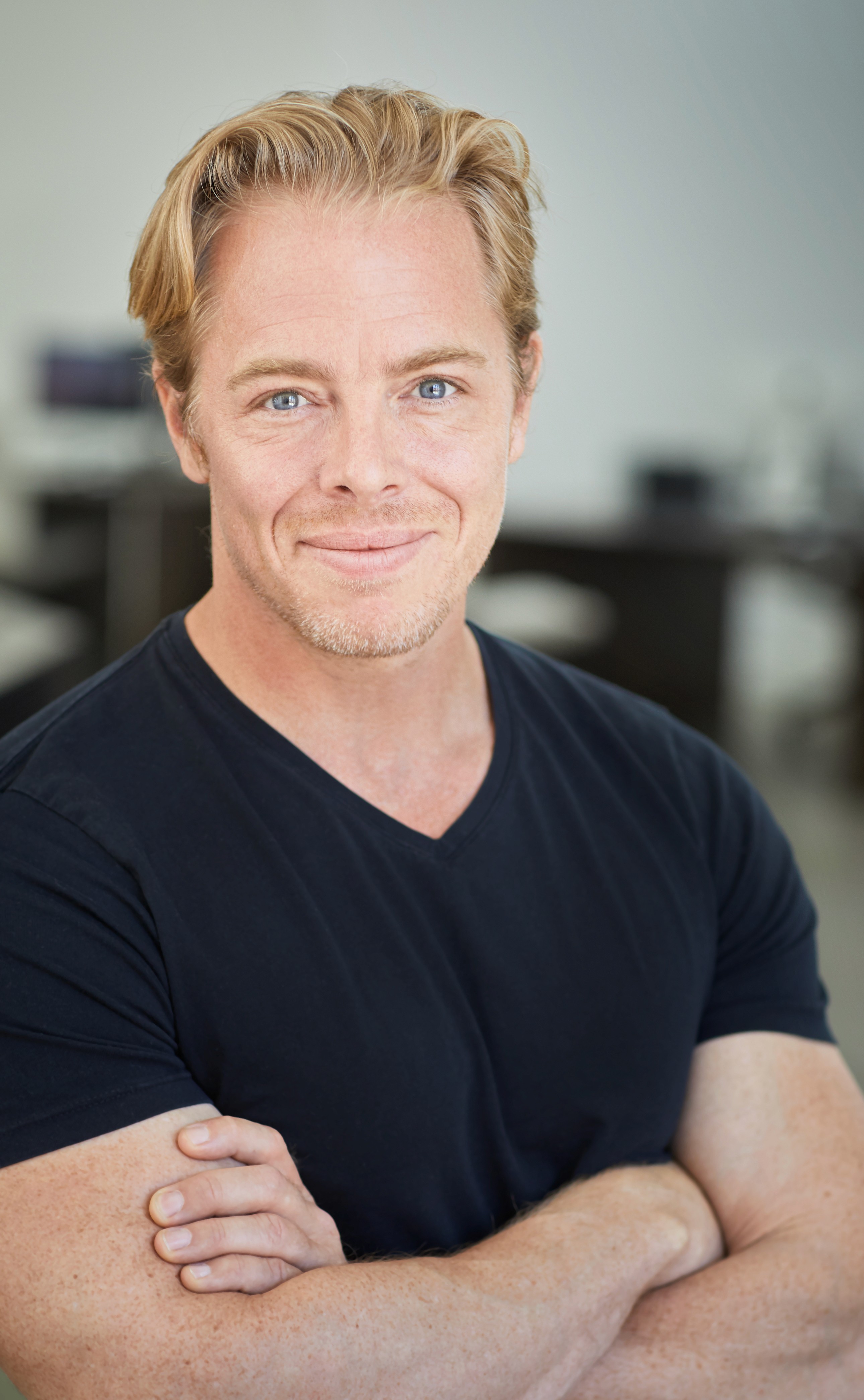 man wearing white V-neck shirt