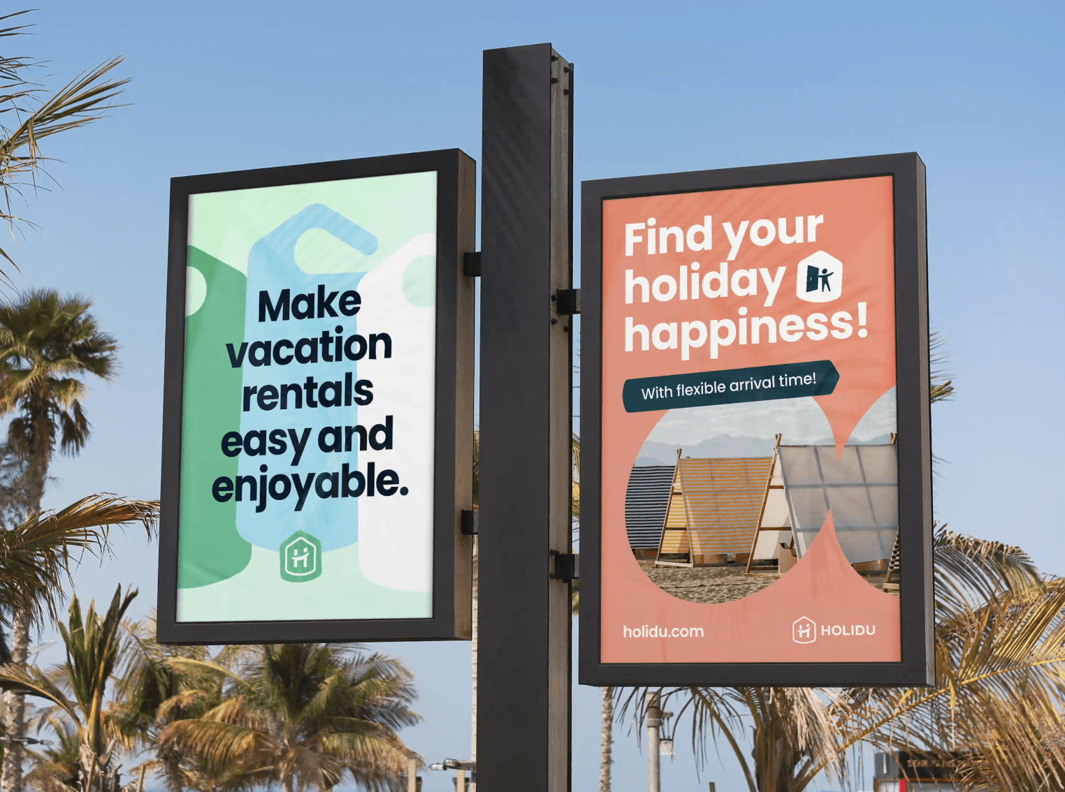 Two billboards on a post display colorful advertisements in a sunny outdoor setting with palm trees in the background.